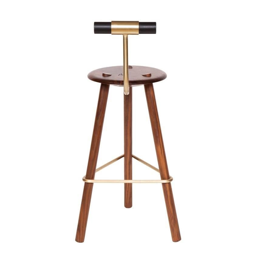 Walnut tripod stool with lacquered backrest and satin brass supports. 
Designed by Ben Erickson for Erickson Aesthetics.

Seat height 27”

Custom orders have a lead time of 10-12 weeks FOB NYC. Lead time contingent upon selection of finishes,