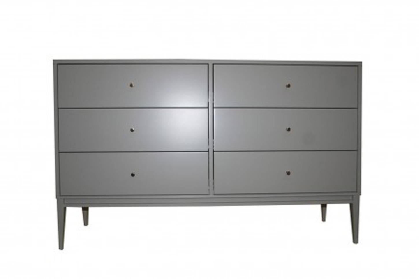 Six drawer lacquered dresser on tapered legs. Solid brass pulls, grey satin lacquer finish, solid maple construction.

Custom orders have a lead time of 10-12 weeks FOB NYC. Lead time contingent upon selection of finishes, approval of shop