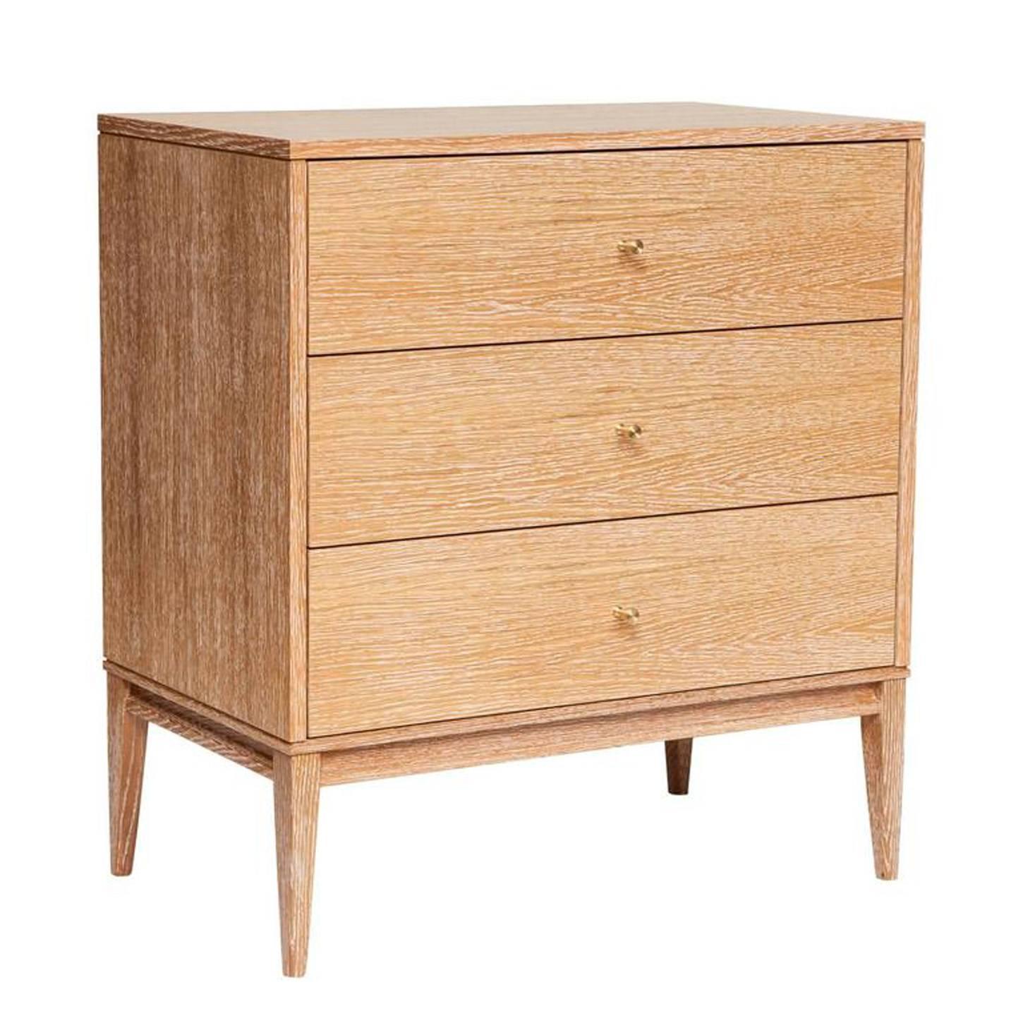 Cerused oak three-drawer dresser on apron frame base detailed with solid brass drawer pulls. Solid maple drawer boxes with under-mount soft close mechanical drawer slides.
Custom lacquer and wood finishes available.

Custom orders have a lead time