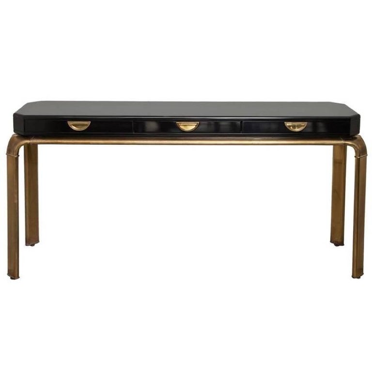 John Widdicomb three-drawer console table, circa 1970s. Polished black lacquer top on bronzed base.