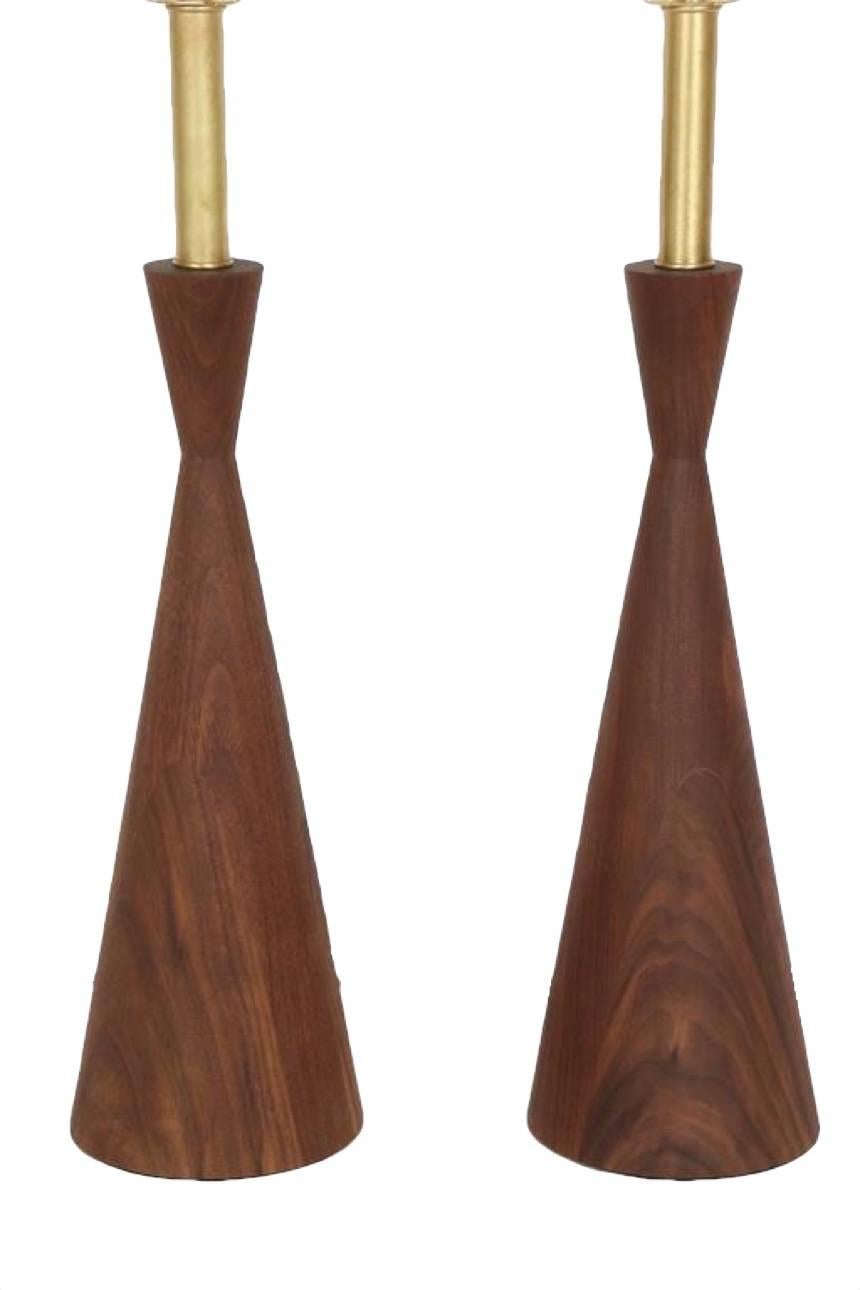 Pair of Samson turned walnut table lamps available in other wood species and finishes. 
Base height 16.75”. 

Custom orders have a lead time of 10-12 weeks FOB NYC. Lead time contingent upon selection of finishes, approval of shop drawings (if