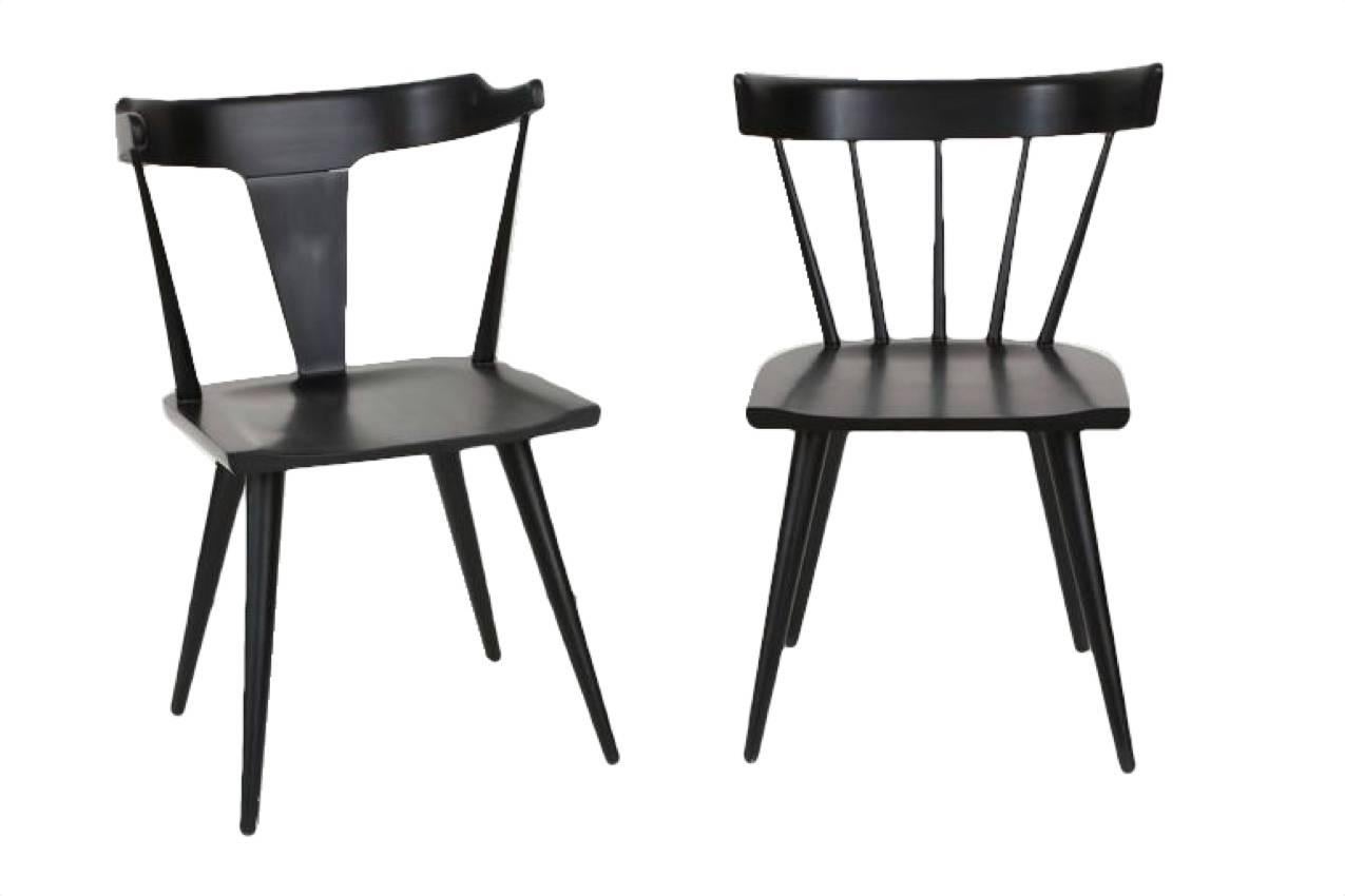 Paul McCobb Planner Group solid maple dining chairs, circa 1950s. Solid wood construction fully restored in a satin black lacquer finish. Classic Mid-Century chair detailing with solid construction makes for a timeless design that works in many