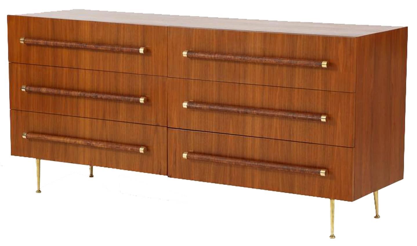 T.H. Robsjohn-Gibbings for Widdicomb six-drawer dresser, circa 1950. Fully restored walnut body featuring caned wrapped drawer pulls with polished brass detailing and legs.