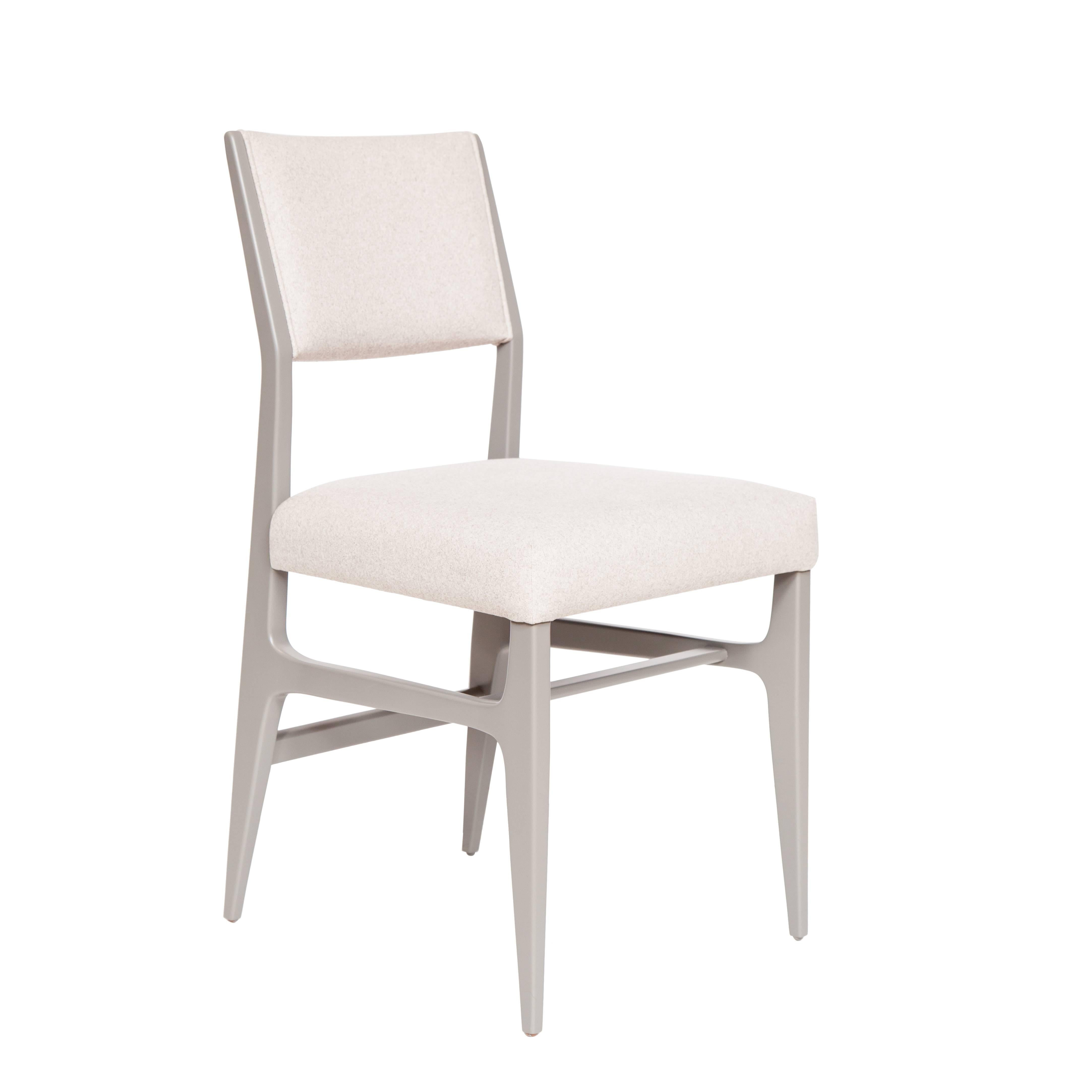 Lacquered dining chair.

Measures: Seat height 19”, 
seat depth 17”. 
COM requirements: 1.5 yards 
5% up-charge for contrasting fabrics and or welting 
COL Requirements: 30 sq. feet 
5% percentage up-charge for all COL or exotic