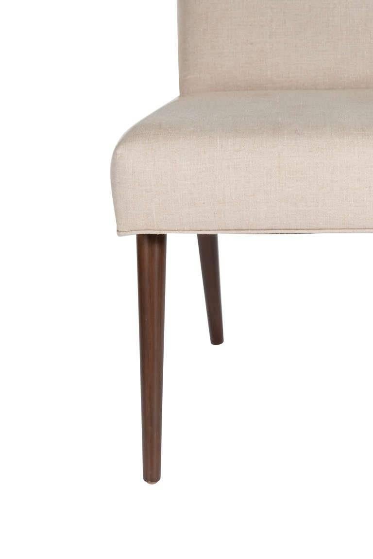 Mn Originals made to order dowel leg upholstered dining chair. Solid maple construction, side and matching armchair styles made to order.

Measures: Seat height 18.5".
Seat depth 16.5".

COM requirements: 1.5 yards.
5% up-charge for