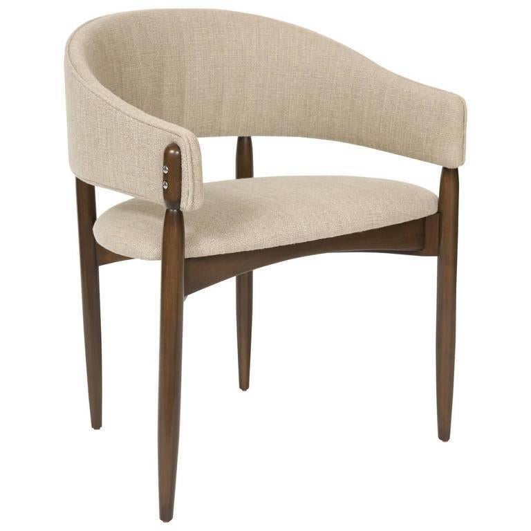 Enroth dining chair.

Measure: Seat height 18” 
Seat depth 18.5” 
COM requirements: 2 yards 
5% up-charge for contrasting fabrics and or welting 
COL Requirements: 40 sq. feet 
5% percentage up-charge for all COL or exotic