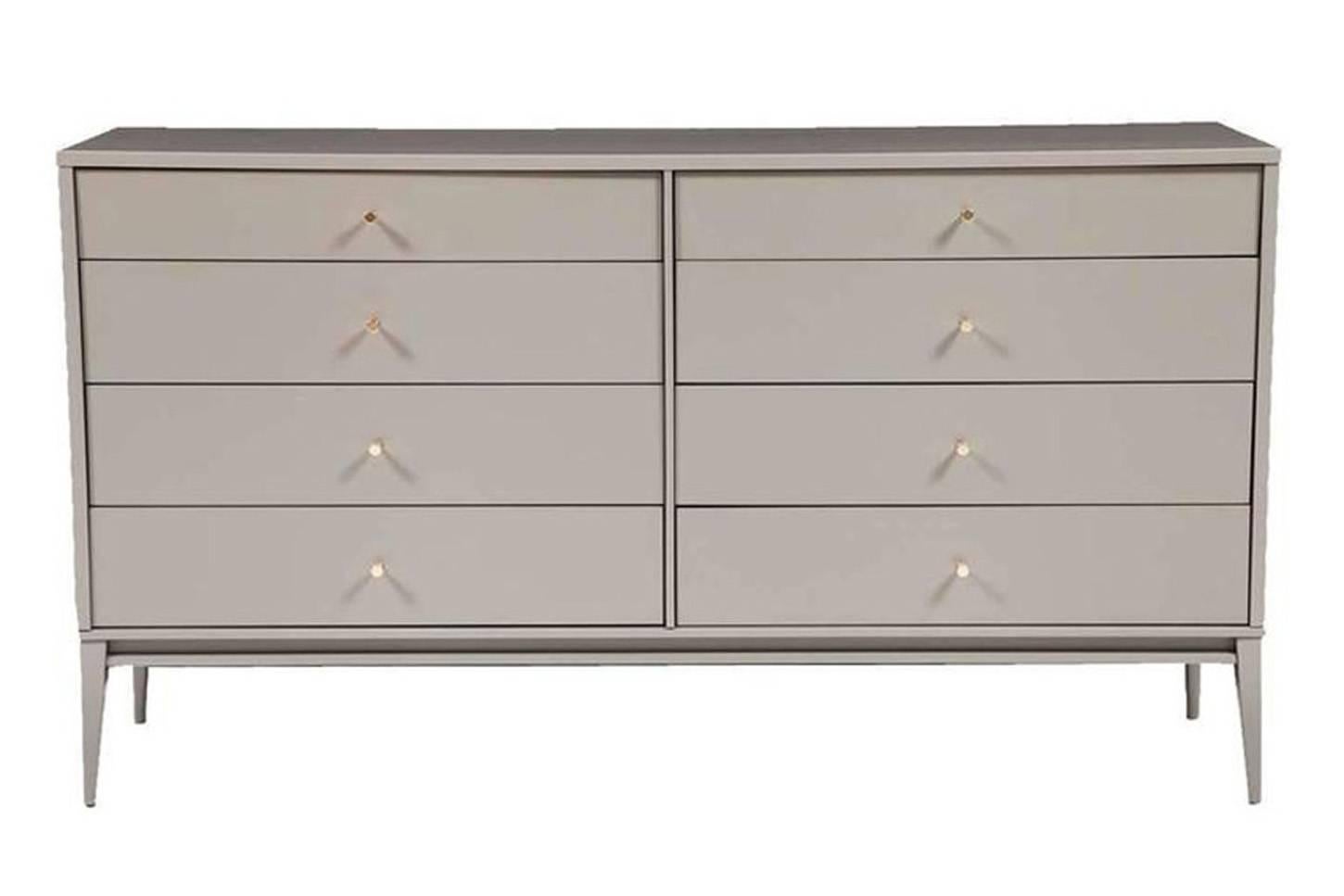 Lacquered eight-drawer dresser on apron frame base detailed with solid brass drawer pulls. Solid maple drawer boxes with under-mount soft close mechanical drawer slides. Custom lacquer and wood finishes available.

Custom orders have a lead time
