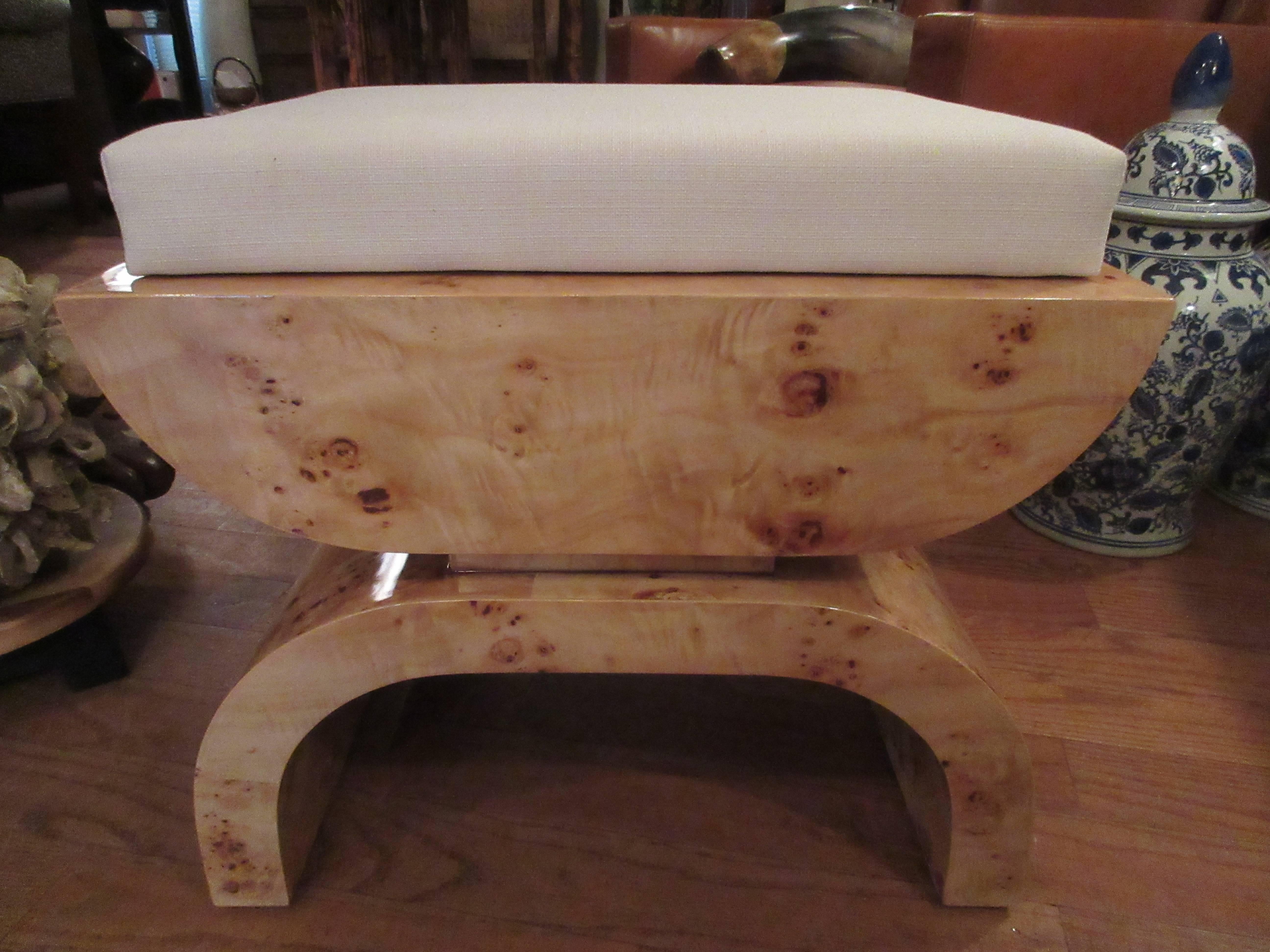 Pair of Asian inspired bird's-eye maple stools or small benches. Art Deco in style, upholstered cushion tops in a cream linen. Heavy construction, solid through the whole frame.