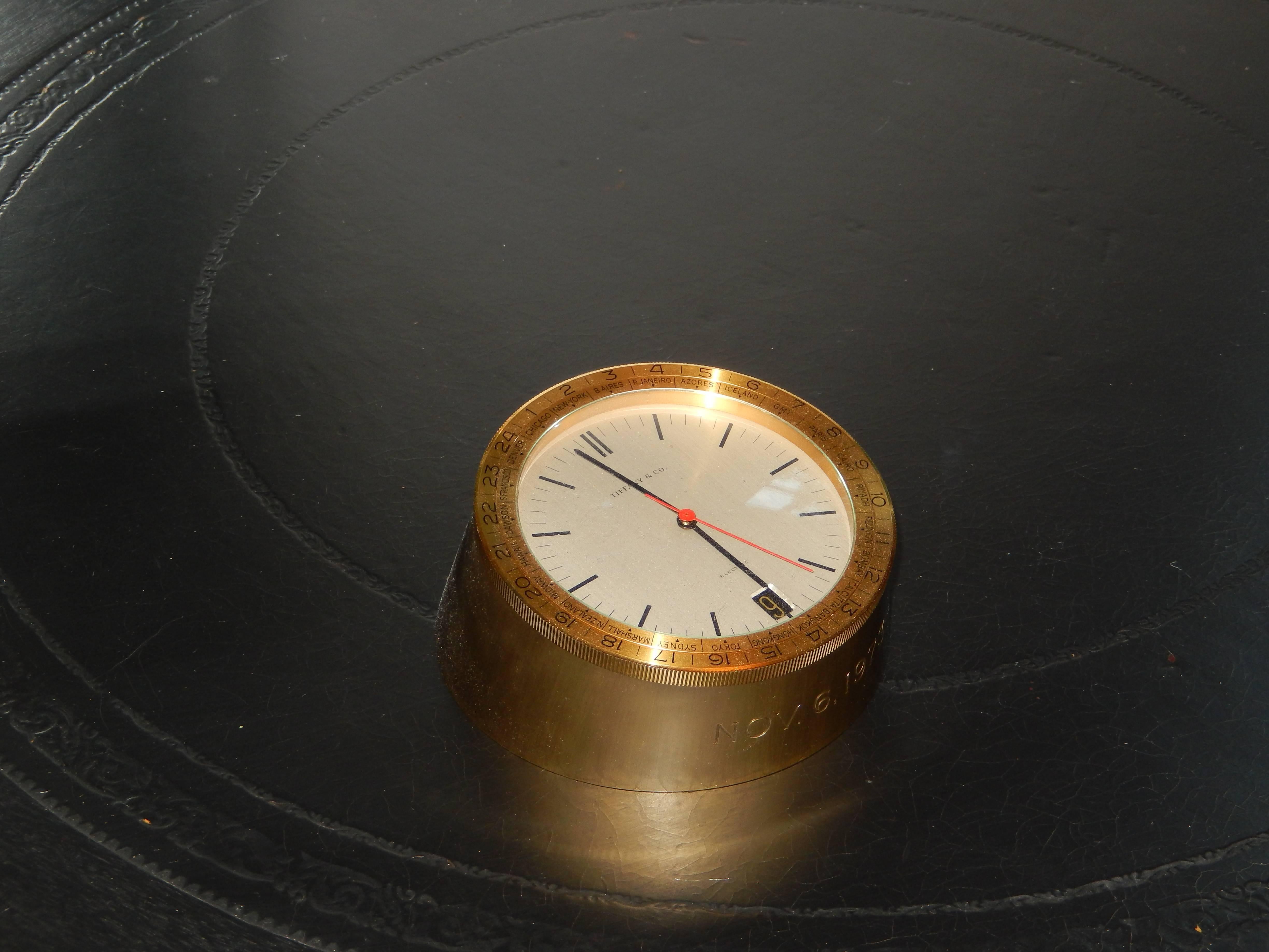 A Tiffany vintage 24 hour solid brass international clock. An inscription on front Nov 6th 1973, lovely condition. Great for the collector.