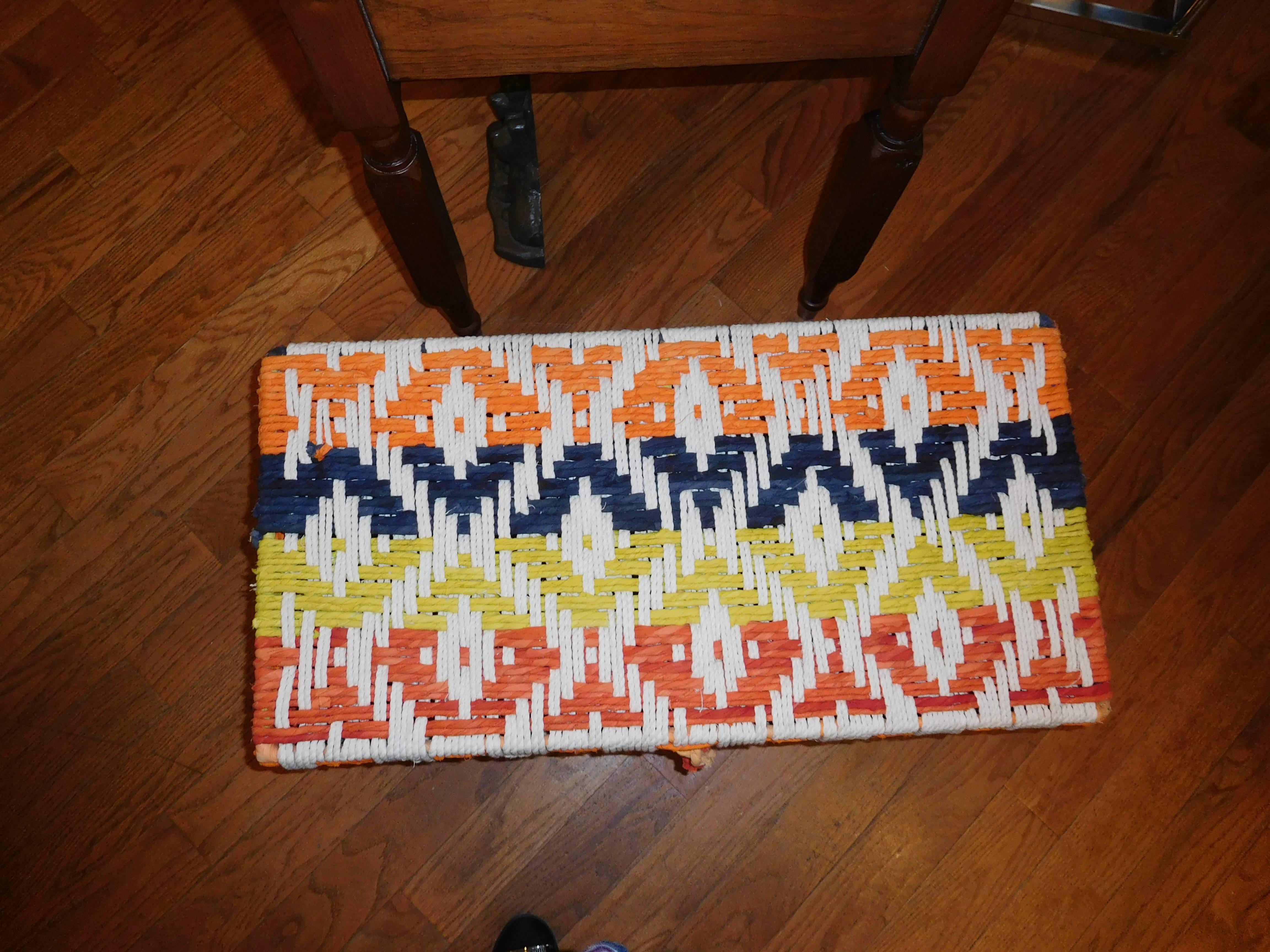 A large handcrafted blue orange and yellow, rope trunk or hamper. Great storage, or coffee table.