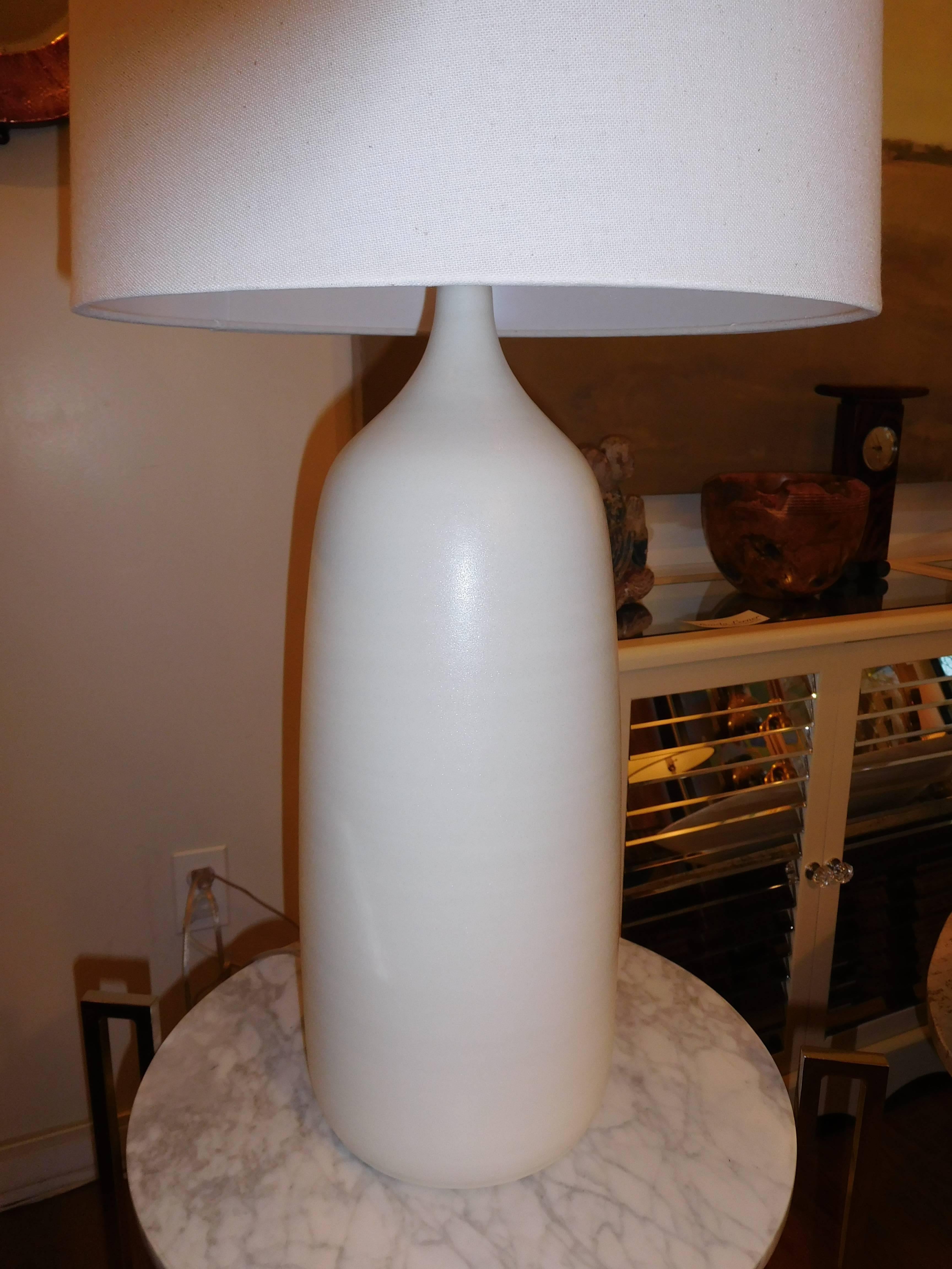 Pair of beautifully textured and handcrafted and hand brushed studio pottery lamps.
There are two available, with a three way light switch up to 150 watts.
Linen shade included.
The measurement from base to socket is 22 inches and 28 inches to the