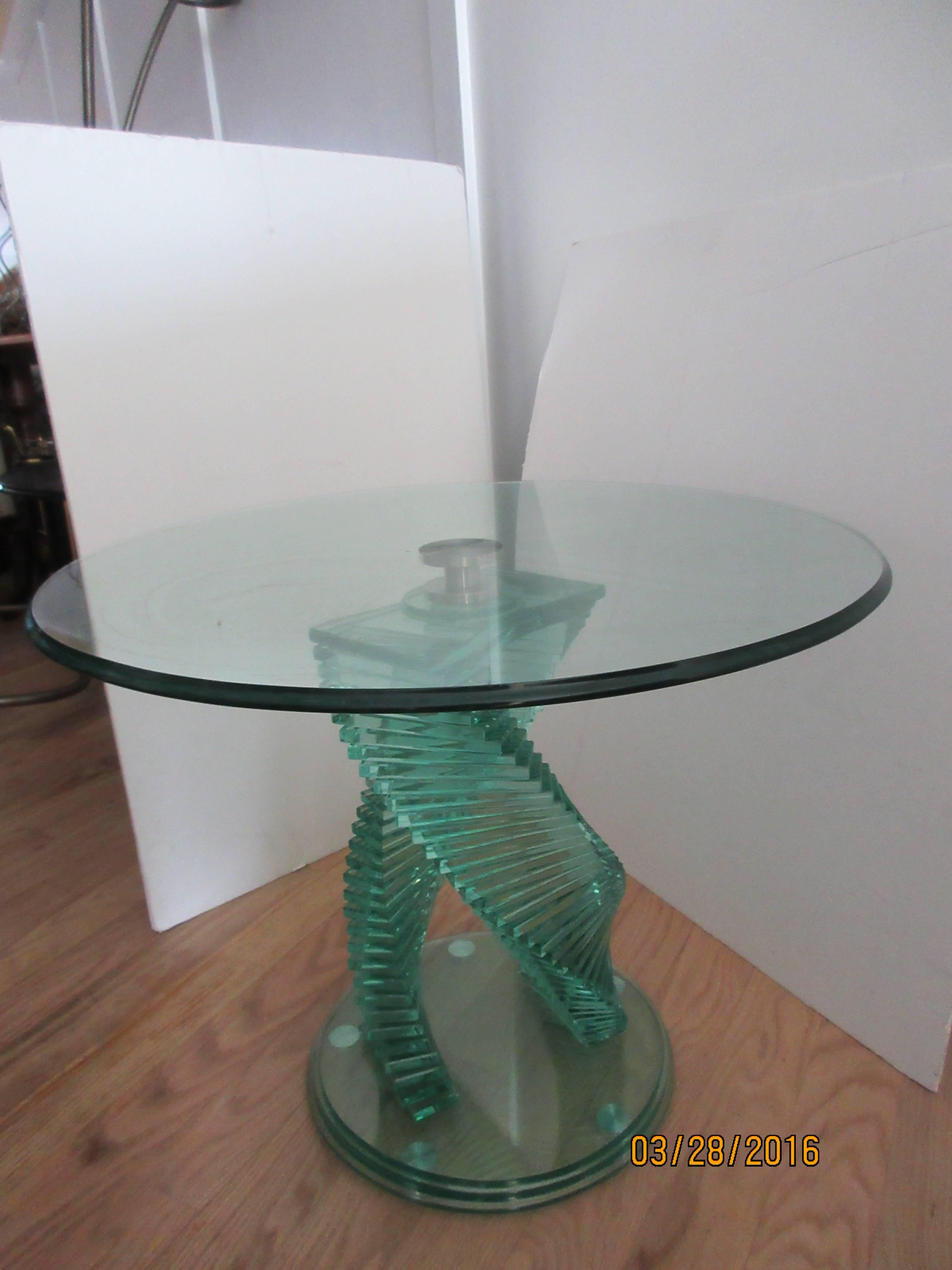 A pair of Danny Lane style modern glass step tables, beautifully designed with a 1/2 inch thick 
beveled top, the base too is over 1/2 inch in thickness. The double step pedestals swirl to a polished chrome center.