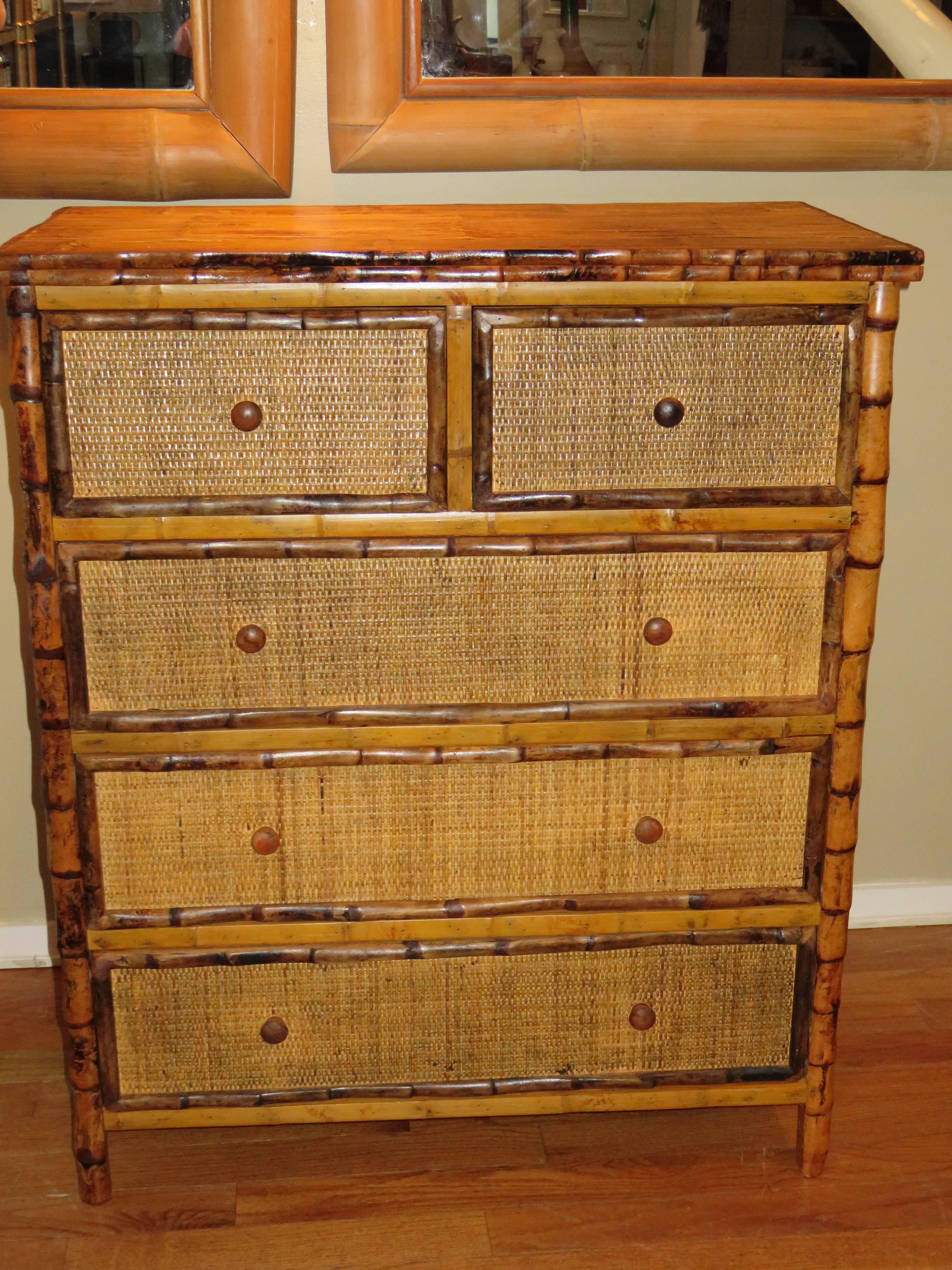 A Bermudan tall bamboo and cane five drawer dresser. All drawers pull out on metal rails for easy use.
Handcrafted in Bermuda in the British Colonial style. Two small top drawers and
three larger drawers, great storage.