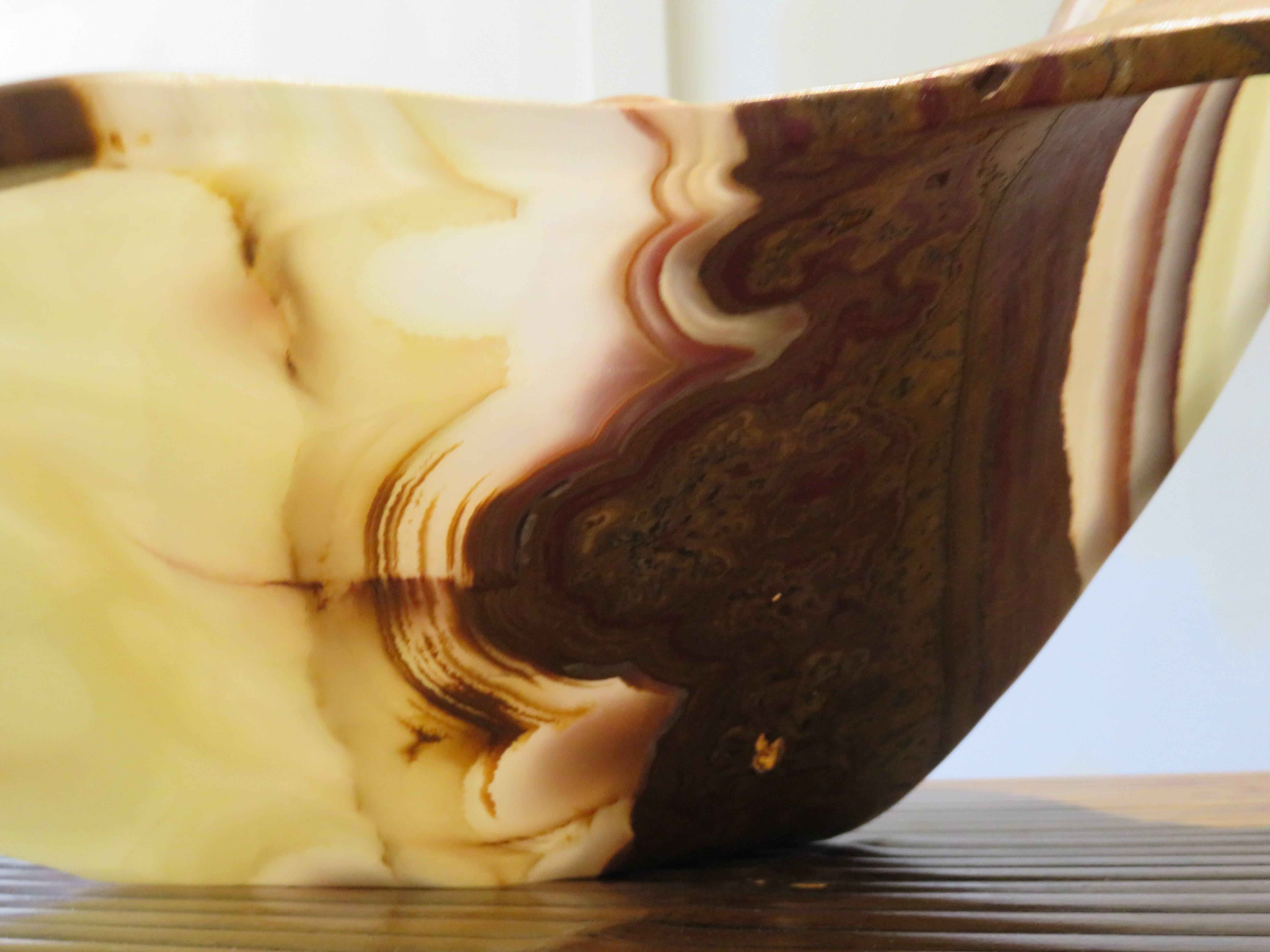 Beautiful and exceptional one of a kind massive free edge shell form onyx bowl/vessel.