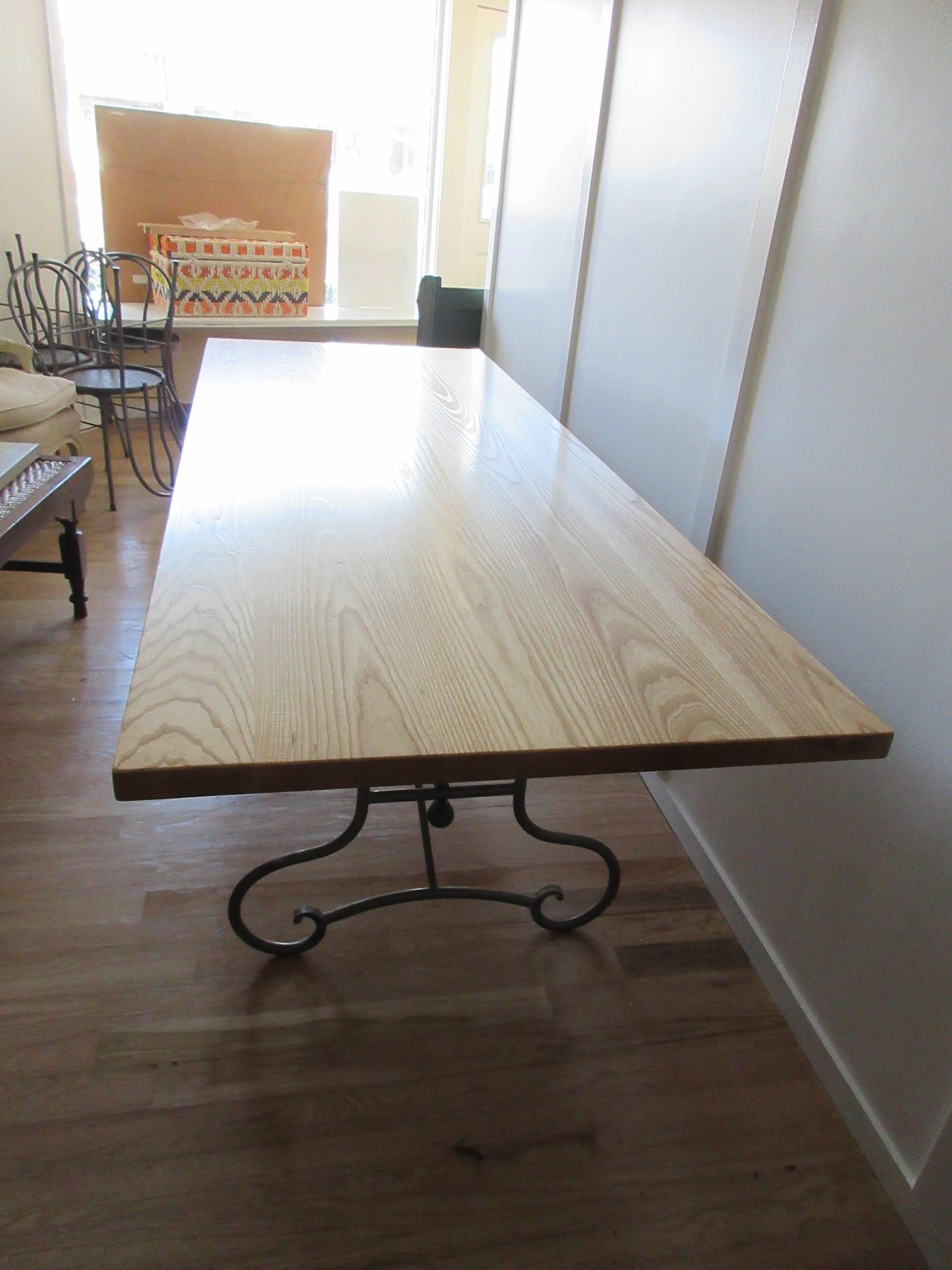 French dinning room table with an Art Nouveau scrolled iron base, paired with a modern new ash wood top, a great look. Seats 10 easily and 12 if needed.
Measuring 8 feet in length.