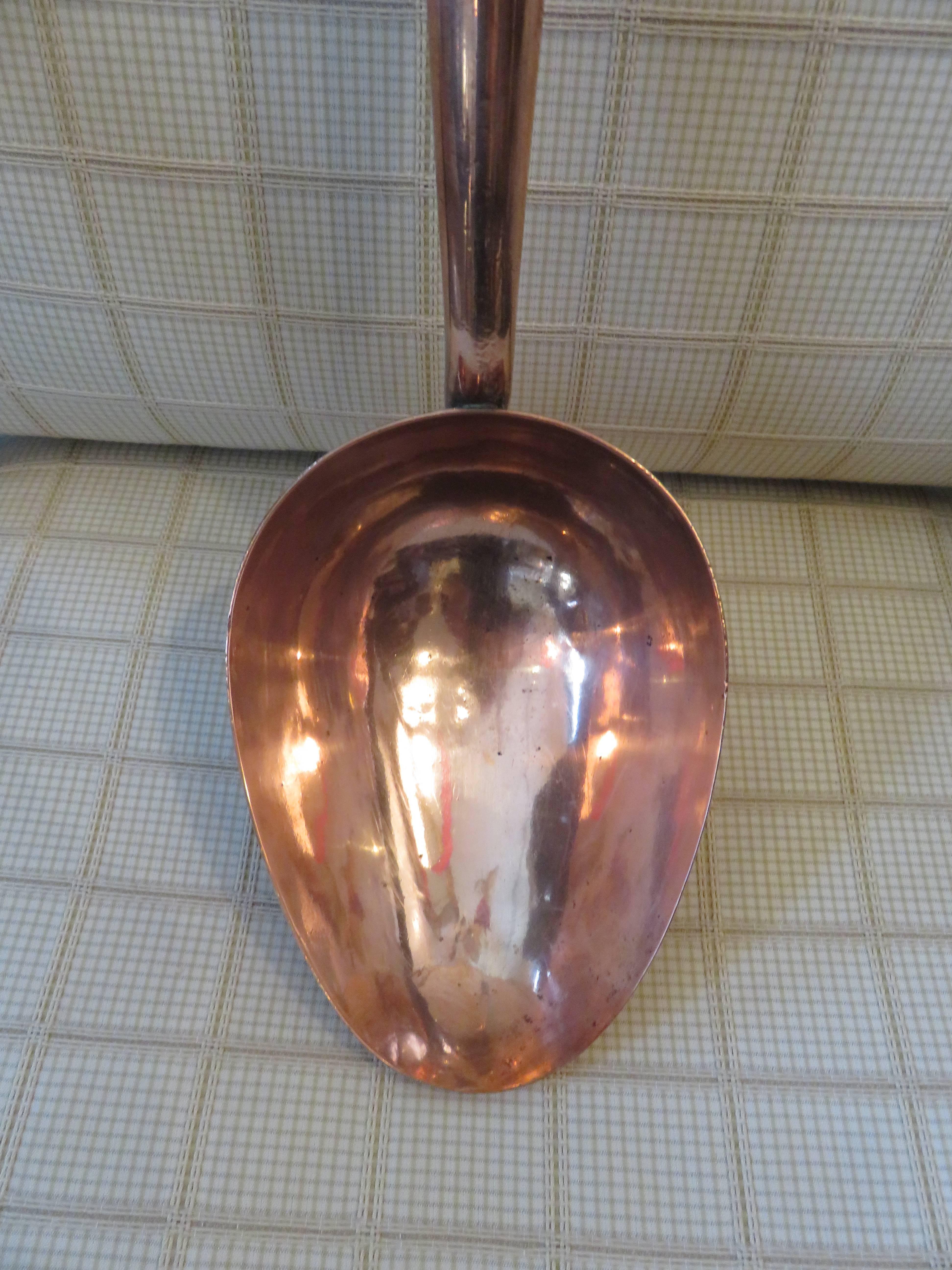 A rare oversized solid copper handcrafted serving spoon. Mahogany wood handles, beautiful condition, circa 1890s, origin England.
