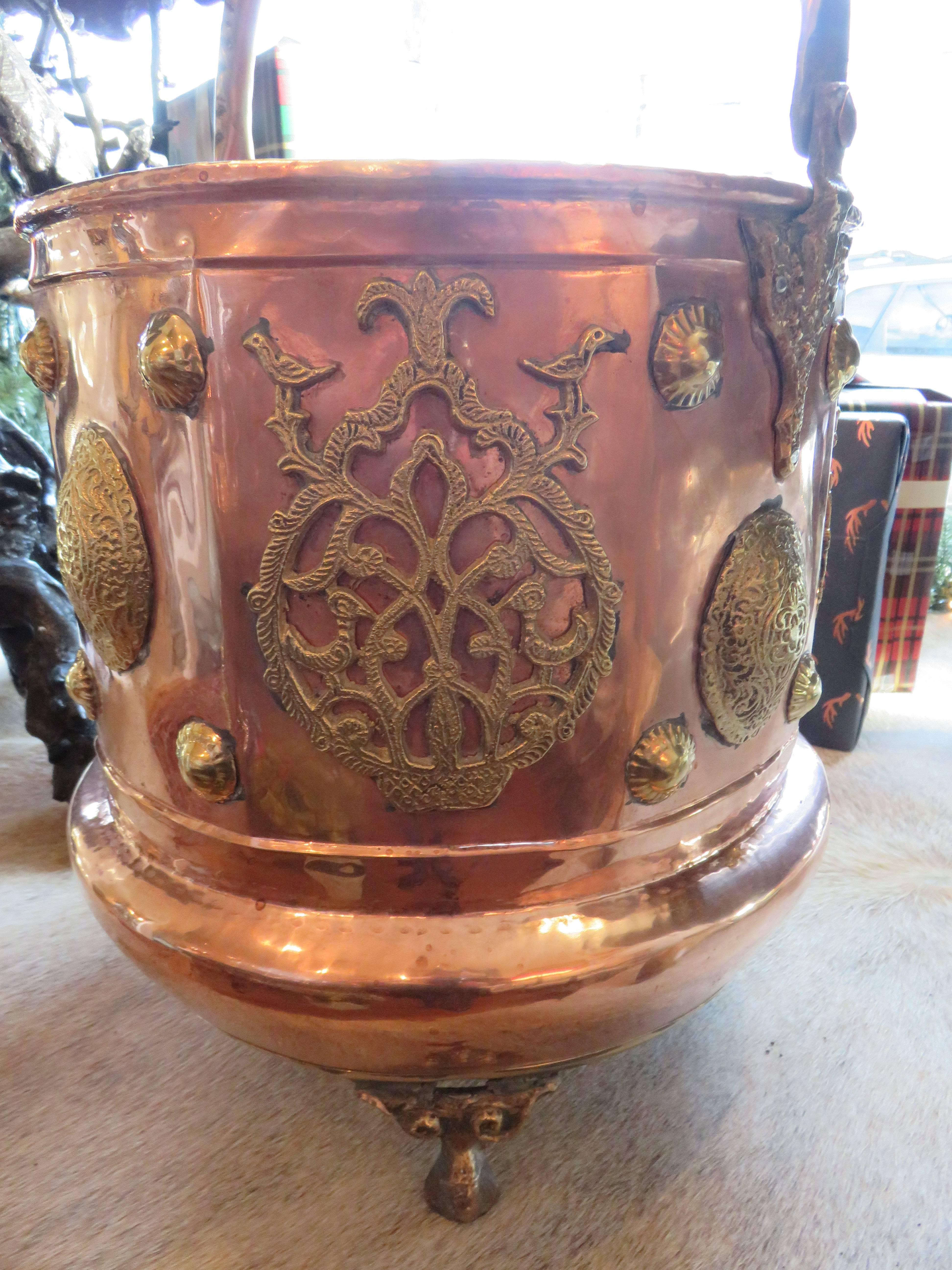 A magnificent hand-hammered brass and copper coal bucket or planter.