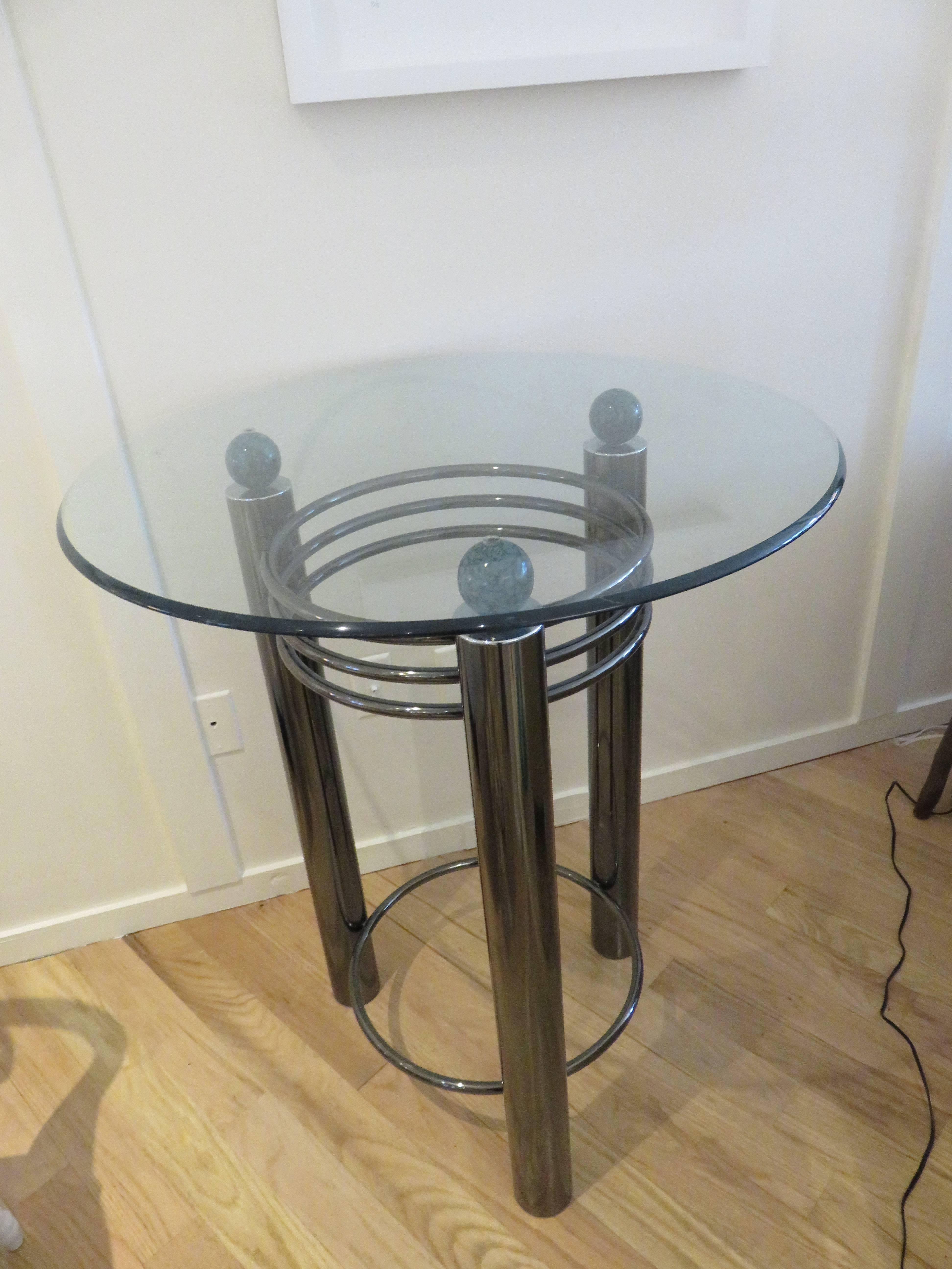 A Mid-Century high top or cocktail table with cylinder chrome legs, three green marbled sphere's hold a one half inch thick beveled glass top. Beautiful original condition.