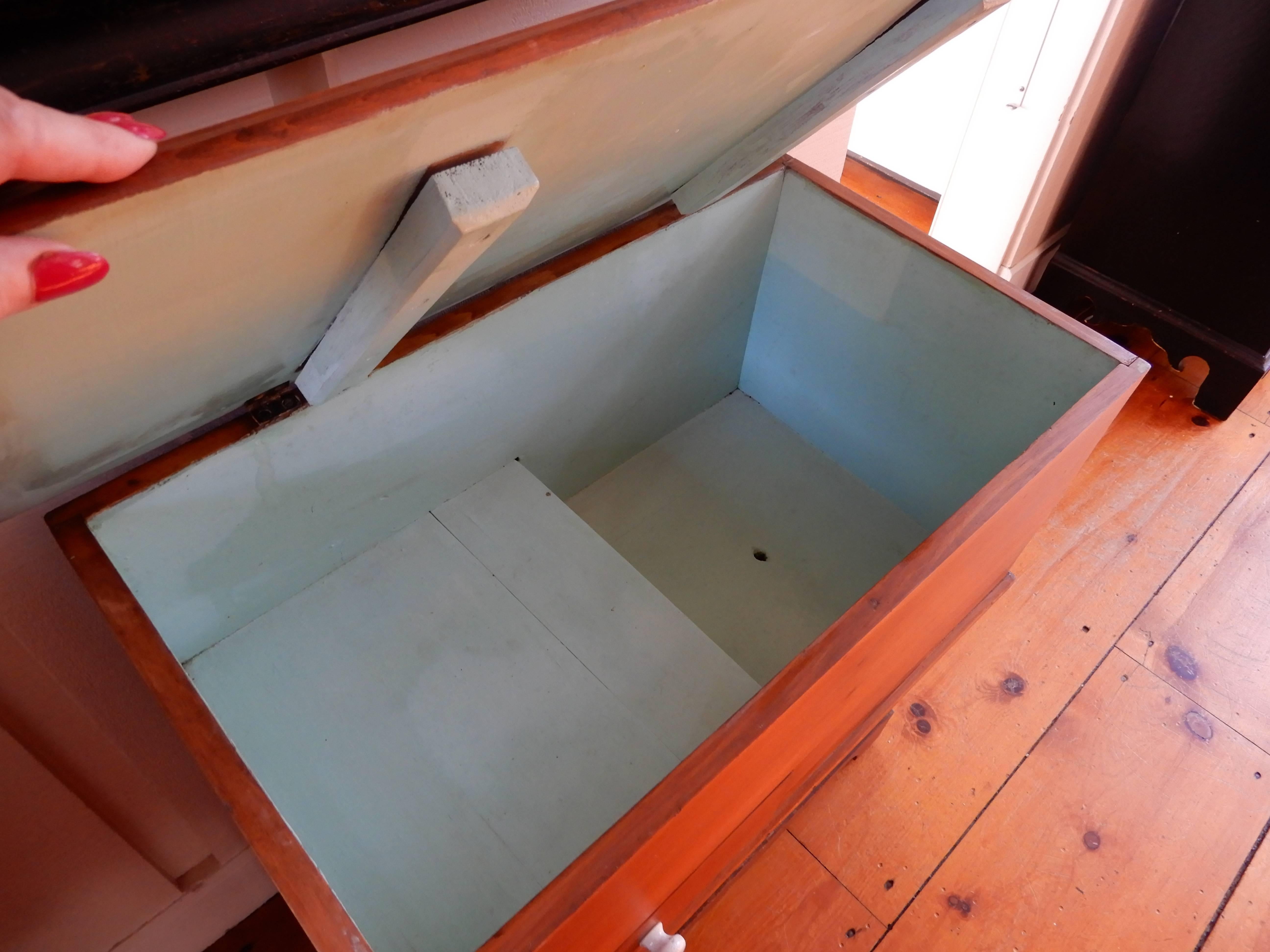 An antique American pine dry sink, the lid opens to a two level storage area, once used to hold a water pitcher, and basin, used in the days when water did not run so readily.  These pieces are often used as bars, or end tables, storage and the like.