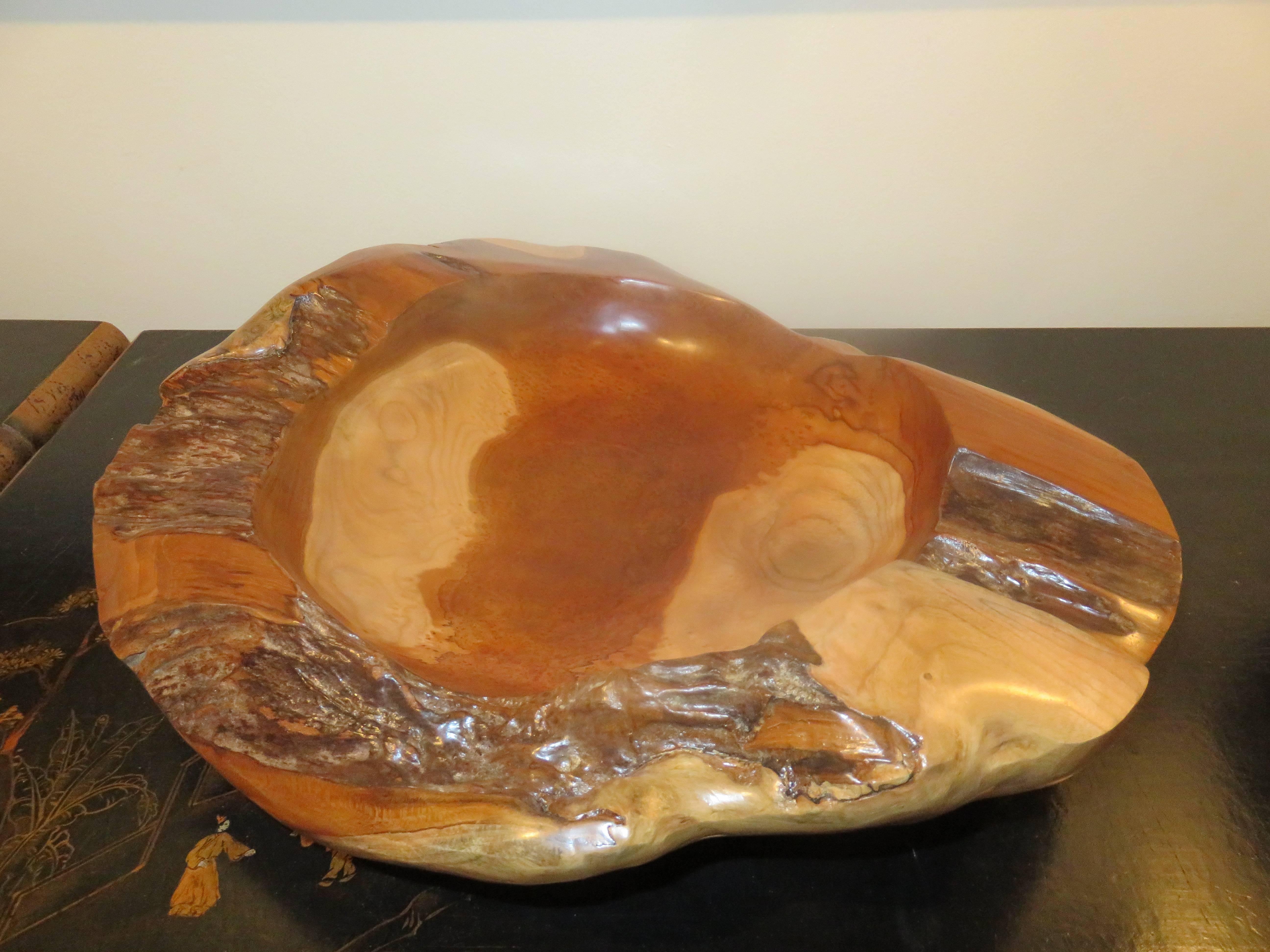 A large studio handcrafted apple wood vessel or bowl, nice variation of natural color and live edge.