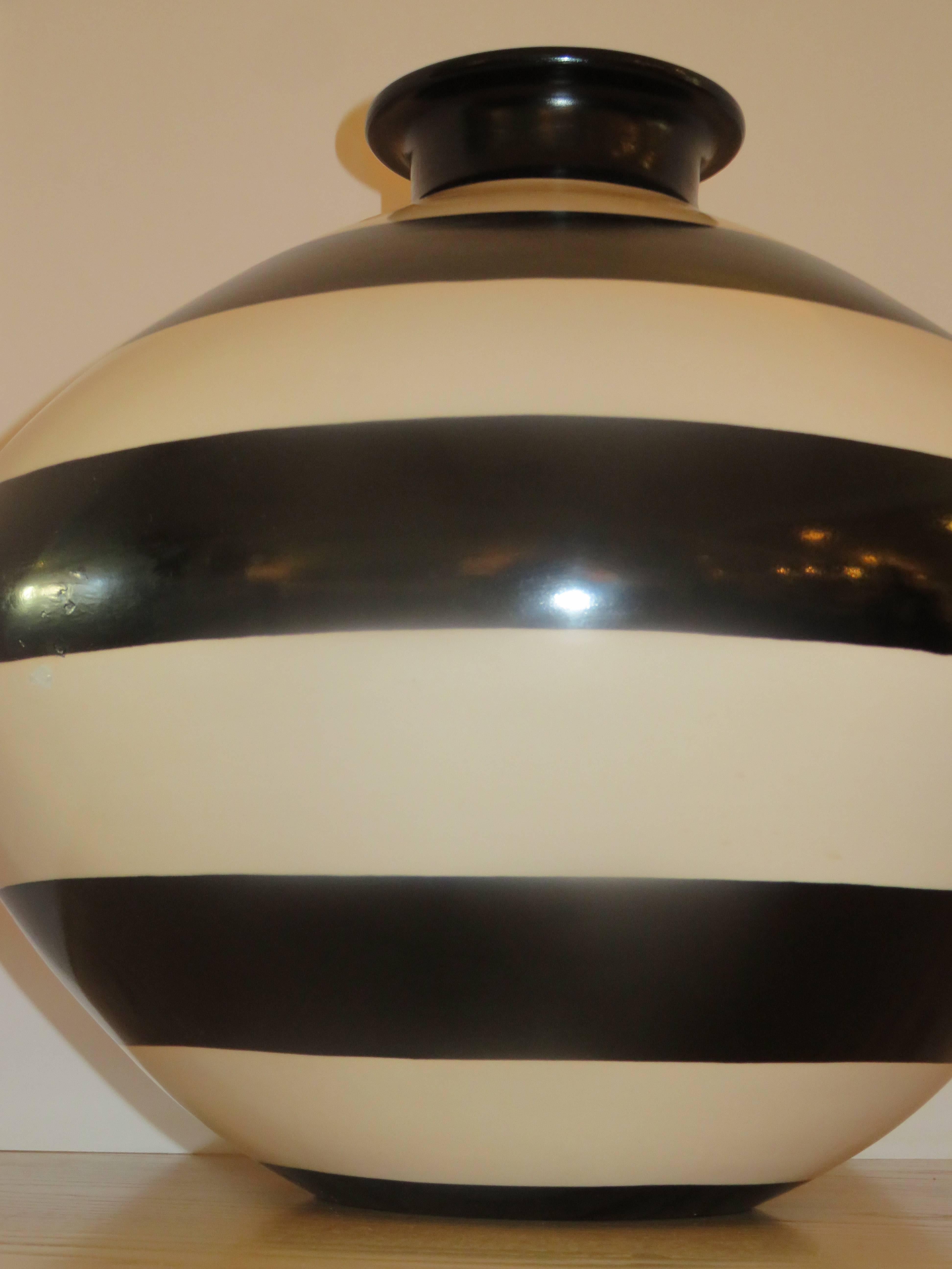 A bold and striking large hand thrown ceramic black and white striped vessel from Studio Calle. Two sizes available this being the largest at 18 inches high and 24 inches wide. The other shown in image 3 is 12 inches high and 20 inches wide.