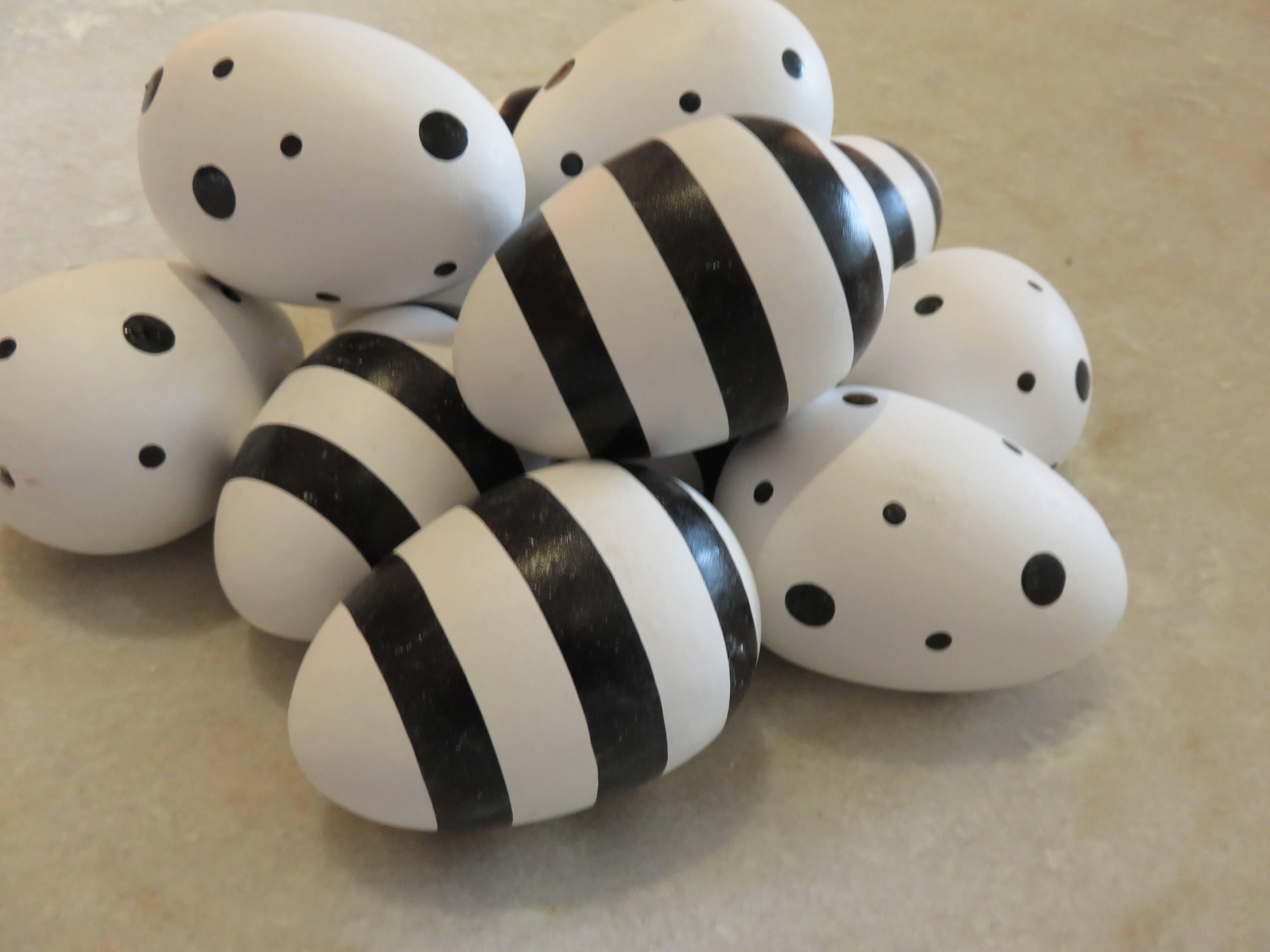 Ten handcrafted and hand-painted Geoffrey Beene ceramic eggs, dots and stripes, showroom props from the 1980s NY.
