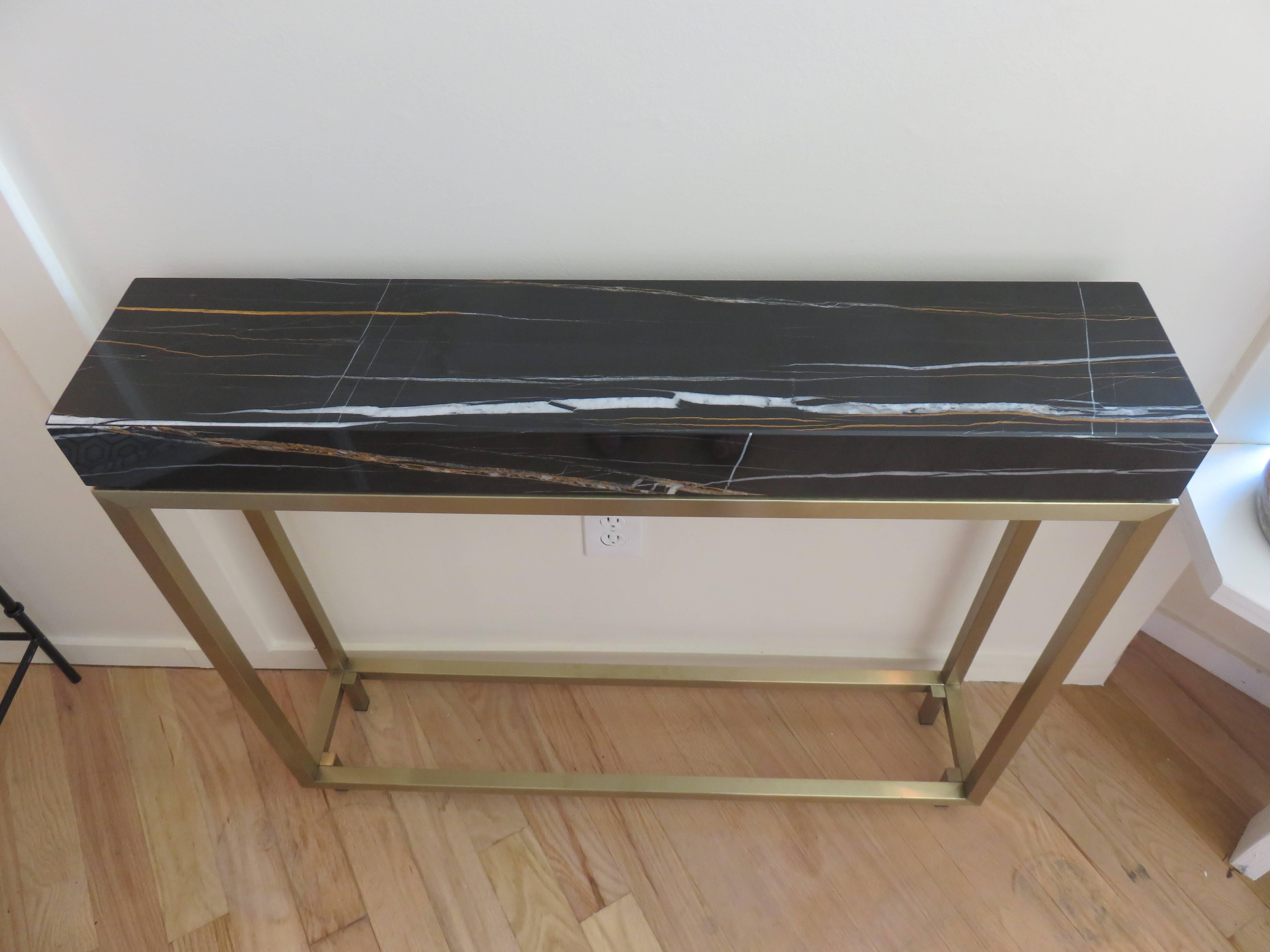 Pair of 1980s, Italian marble and bronze console tables, can be purchased separately.
Hi-definition and well detailed marble, note the variations as each console is unique.
This has a brushed bronze finish, immaculate condition.