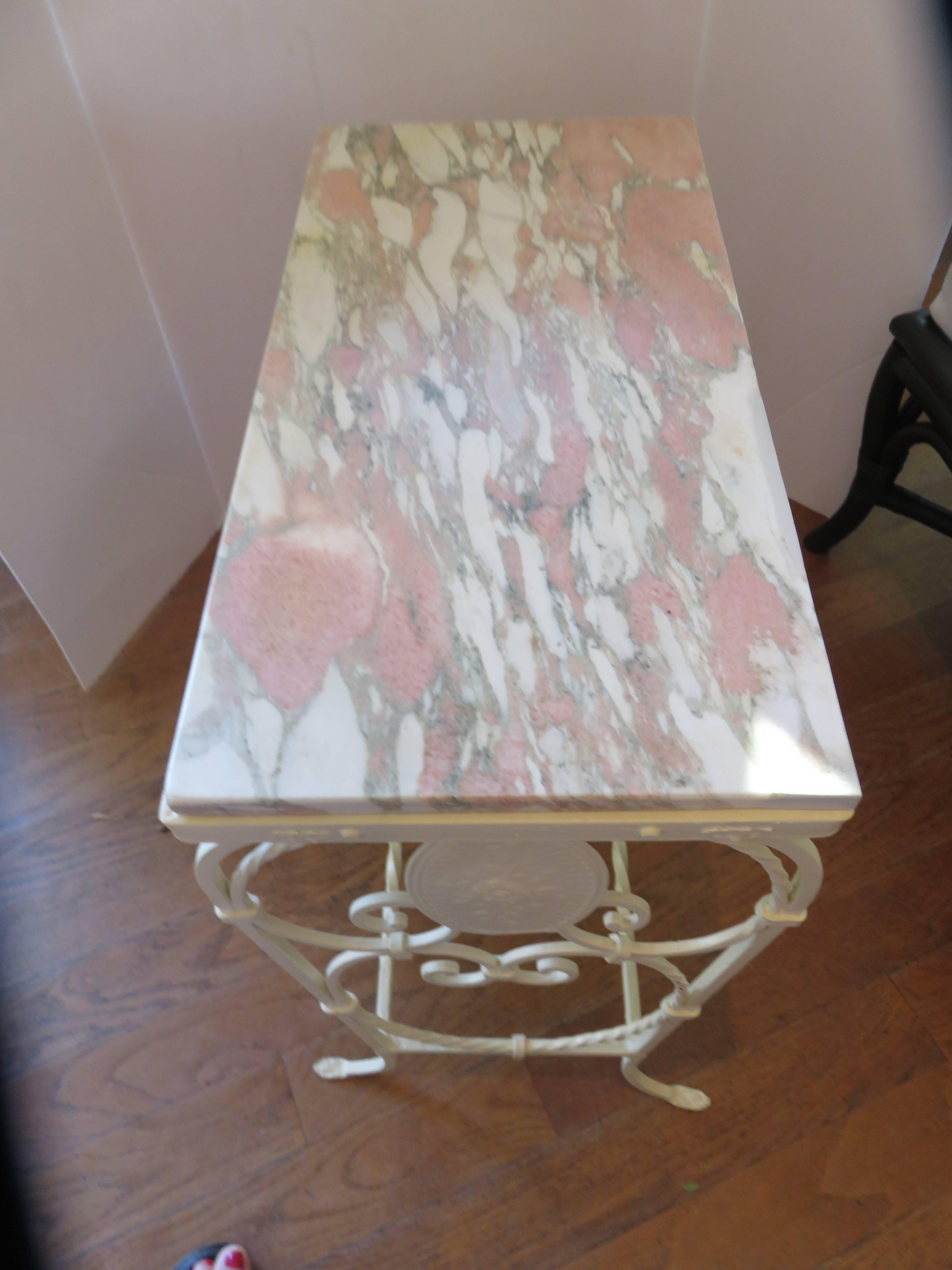 A French, Art Nouveau 1920s marble and iron side-table or end table. Rare coral/ pink and cream original marble top, handcrafted well detailed iron work, lovely piece.