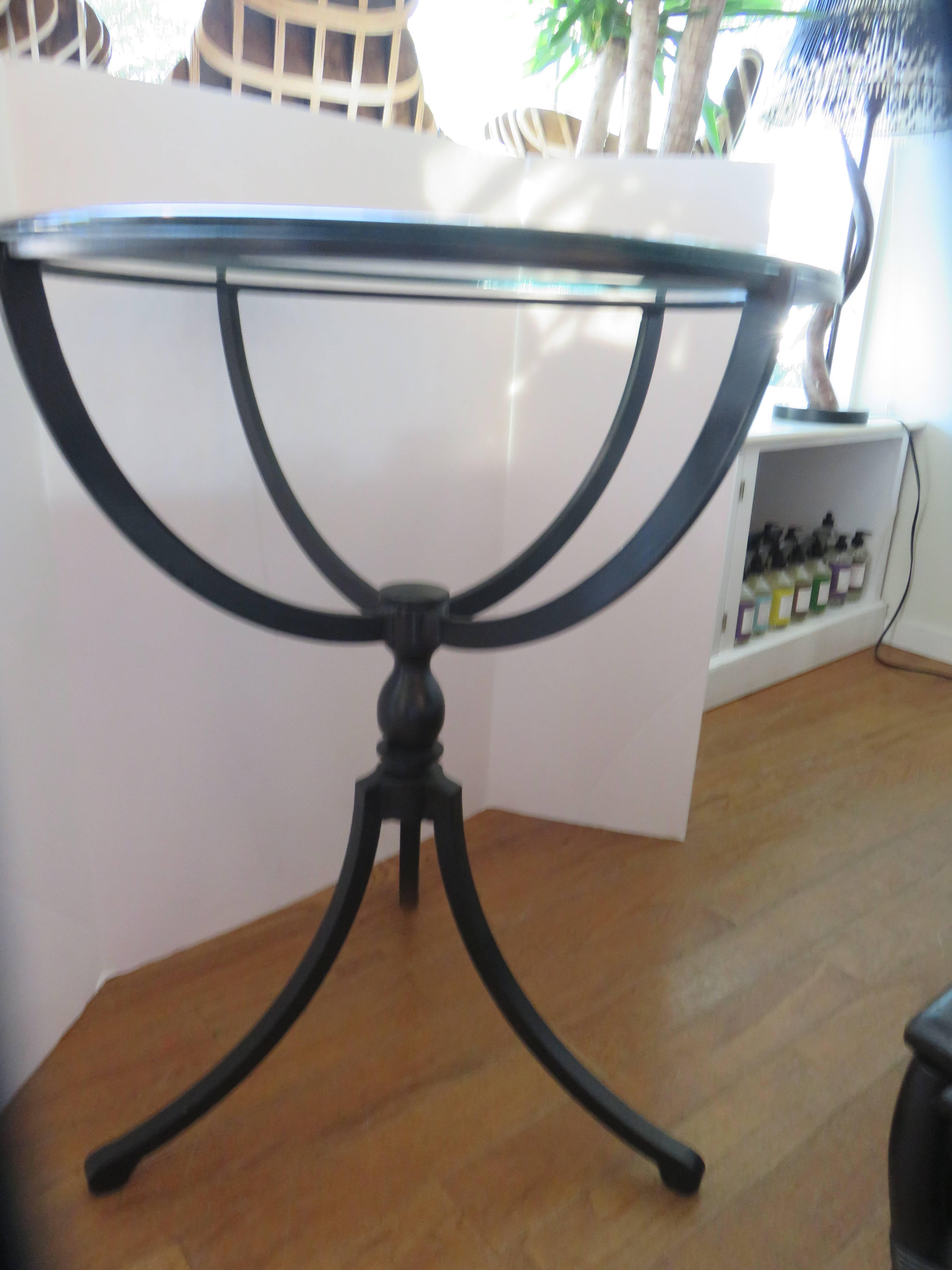 Hand-forged Gueridon form black iron table. Thick beveled edge glass top.
Period Greek Revival.