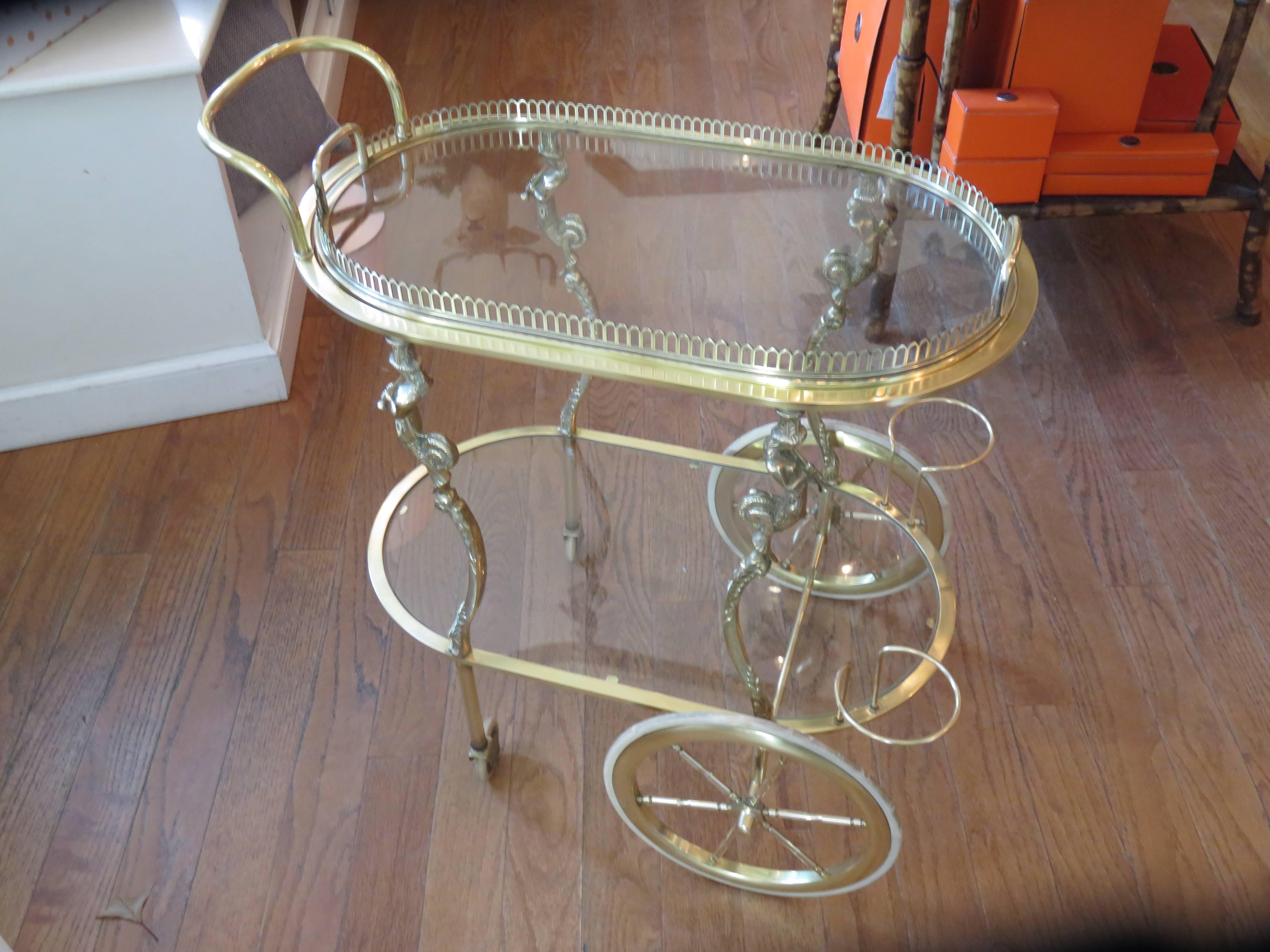 A rare find in this beautiful solid brass highly detailed Maison Baguès Bar Cart. The tray removes on the top, the piece is ornate and fine, even the little square screws are all handmade. Piping female figures adorn all four legs, the craftsmanship