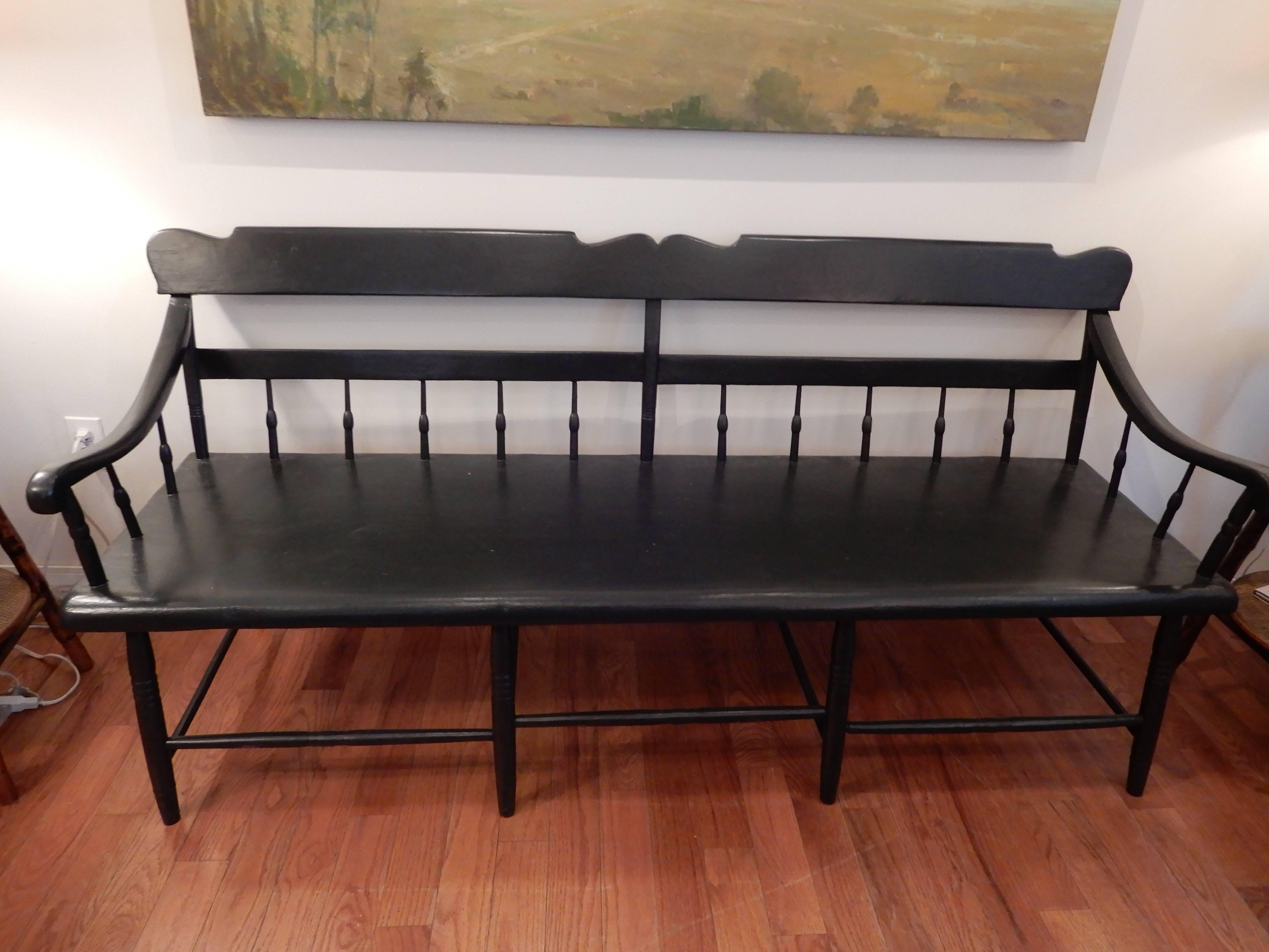 A late 19th Century  Pennsylvania  Dutch Deacons bench. Great condition,painted black,works great in an entrance way,or as dining seating,anywhere.