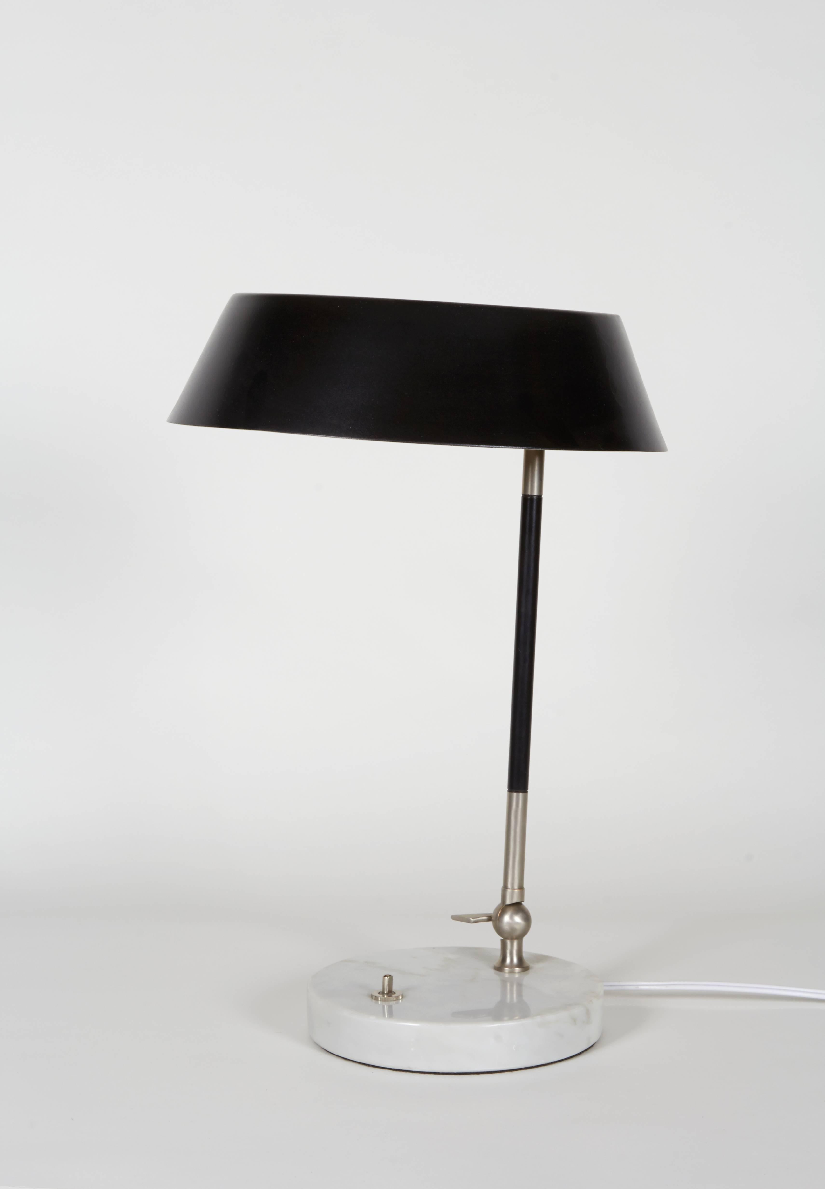 Unattributed but clearly a quality lamp probably by one of the better known Mid-Century Italian designers. Superior hardware, a marble base and an incredible amount of articulation for a lamp of its type.