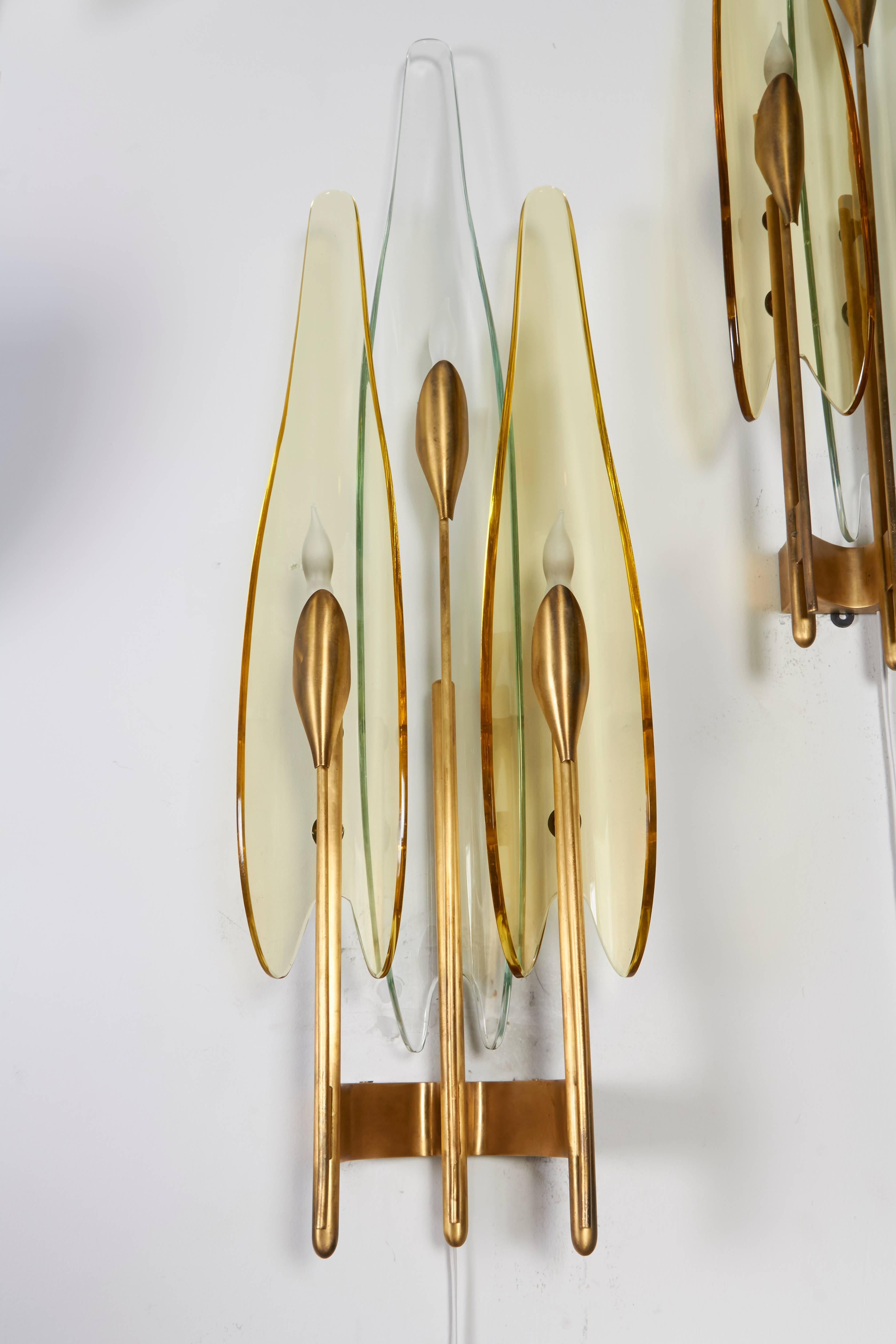 The Dahlia sconces designed by Max Ingrand are Mid-Century elegance at its best.