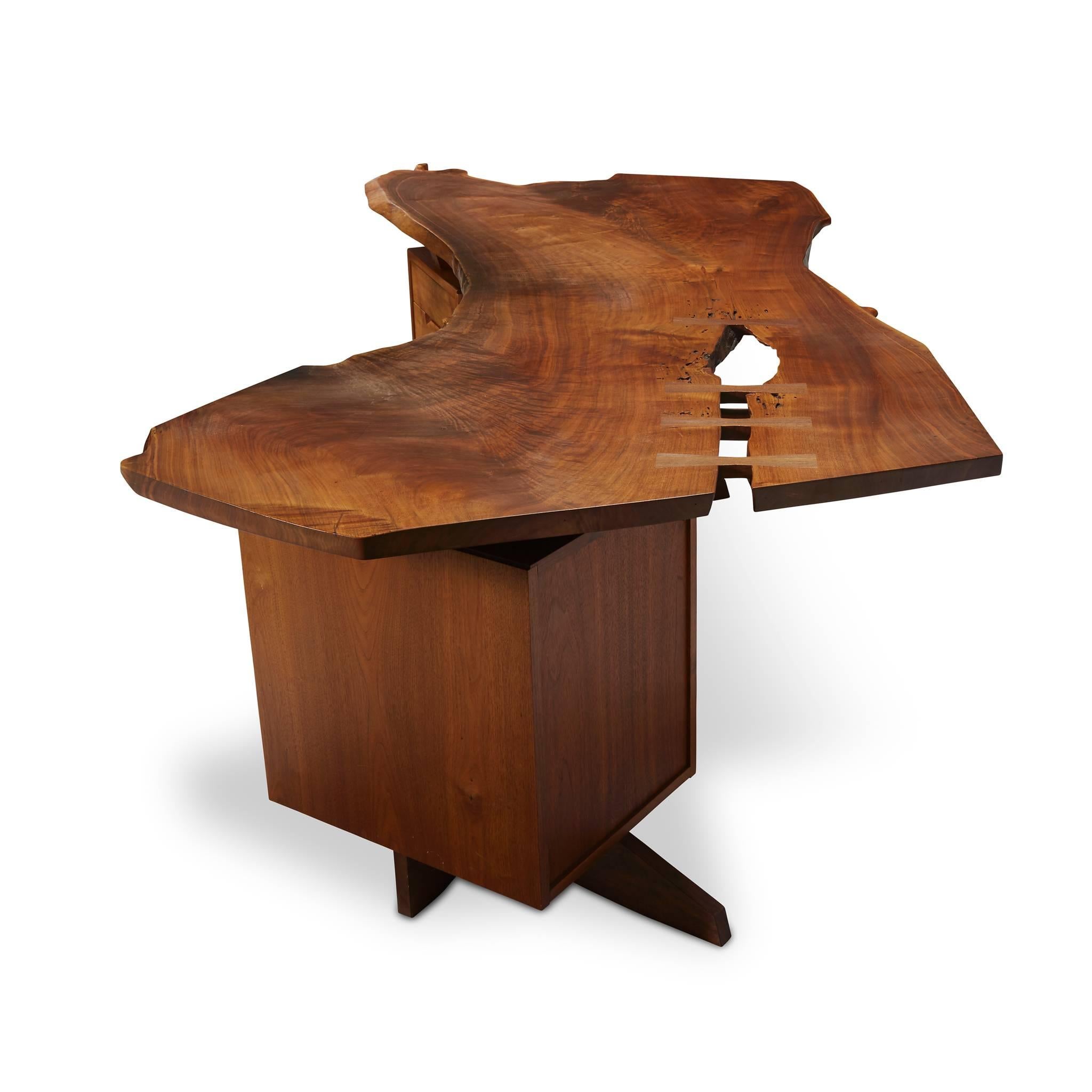 A truly exceptional George Nakashima desk with incomparable details. It's size and drawer configuration make this desk as functional as it is beautiful.