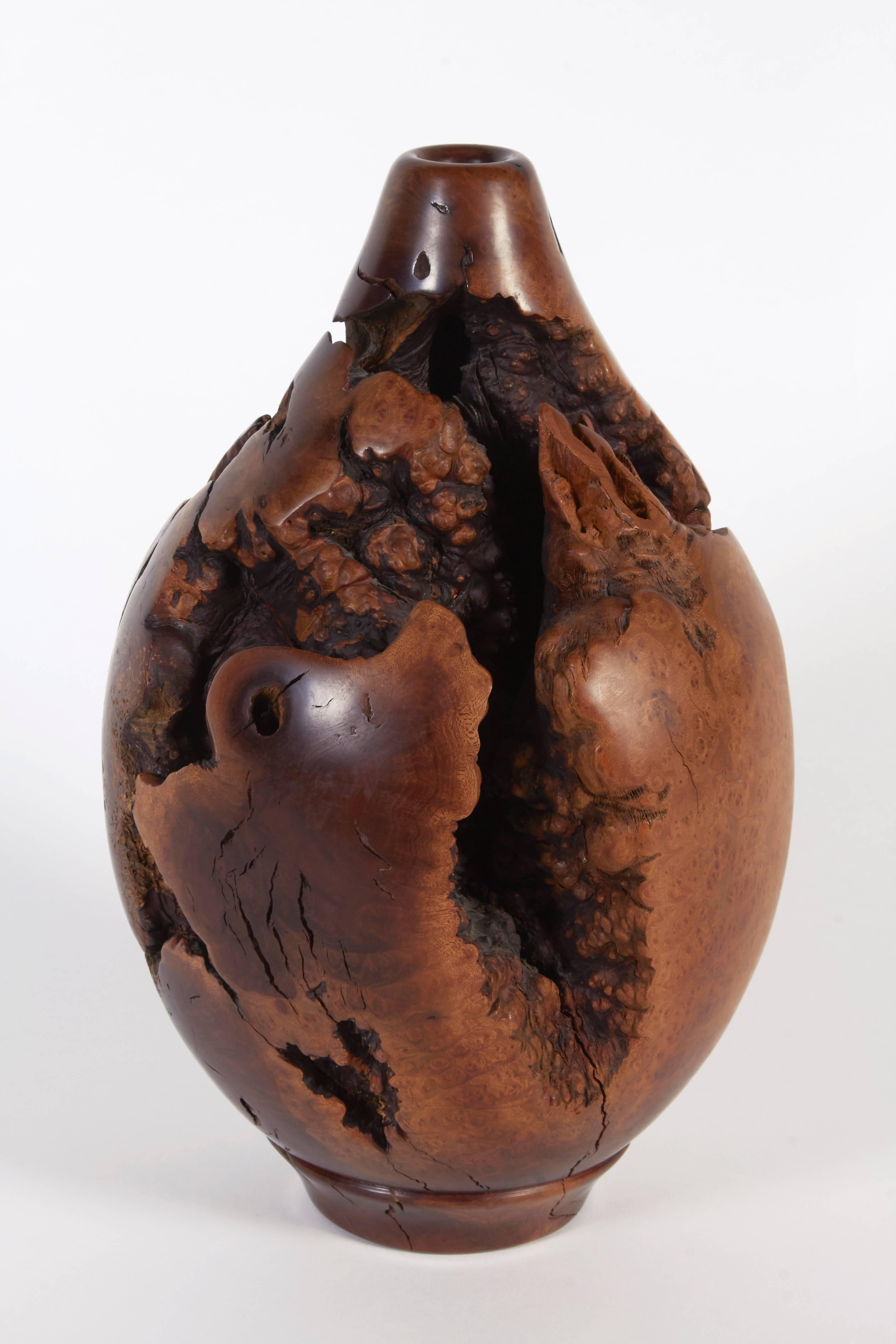 Melvin Lindquist began turning in the 1930s as a vertical turret lathe operator for the General Electric Company. In his shop at home, he began an exploration of the vase form through woodturning which has continued for over fifty years. He was one