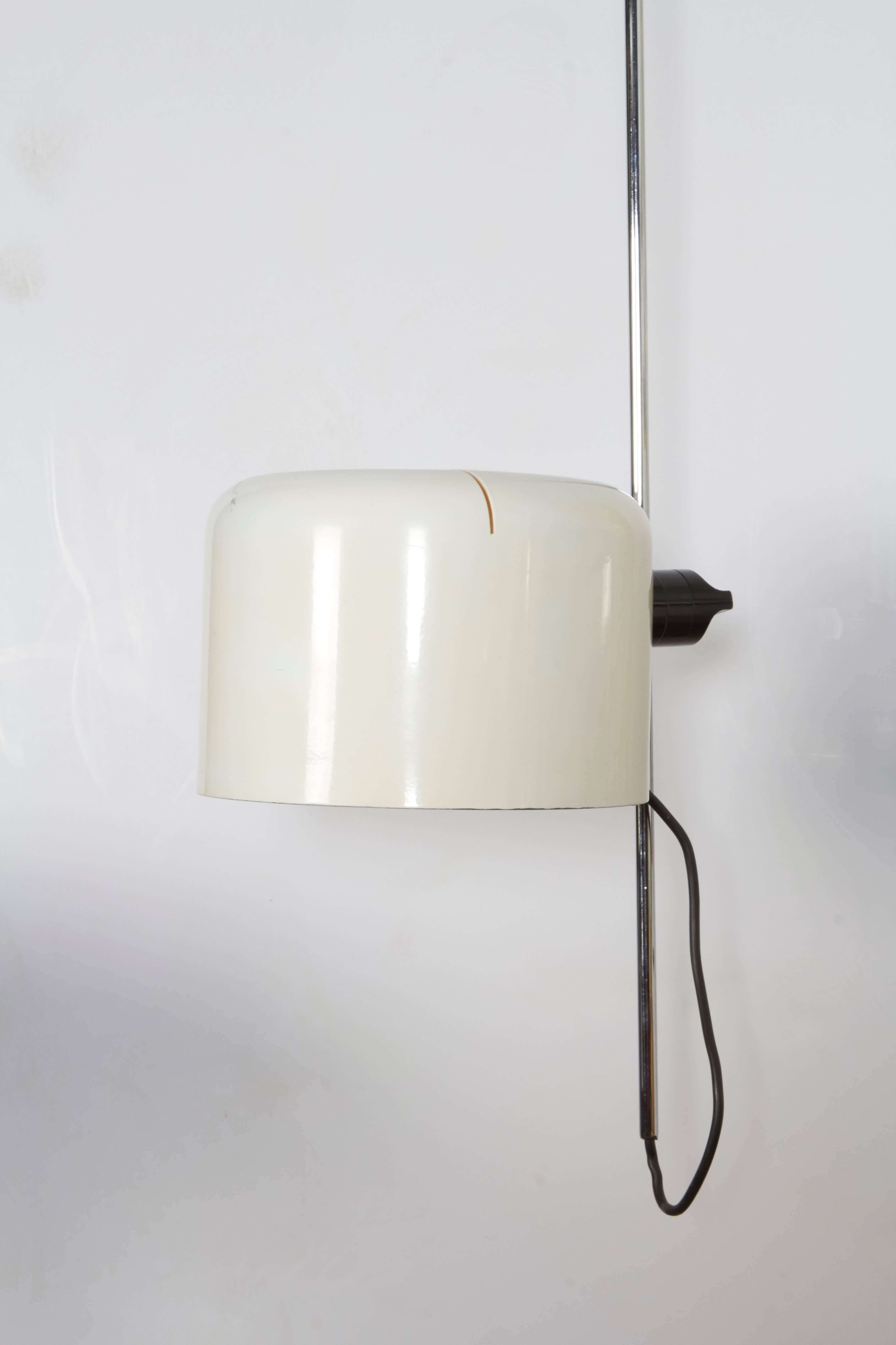 An amazingly versatile ceiling light able to rotate horizontally from the ceiling or at the bottom as well as adjust vertically. A unique and rare design.