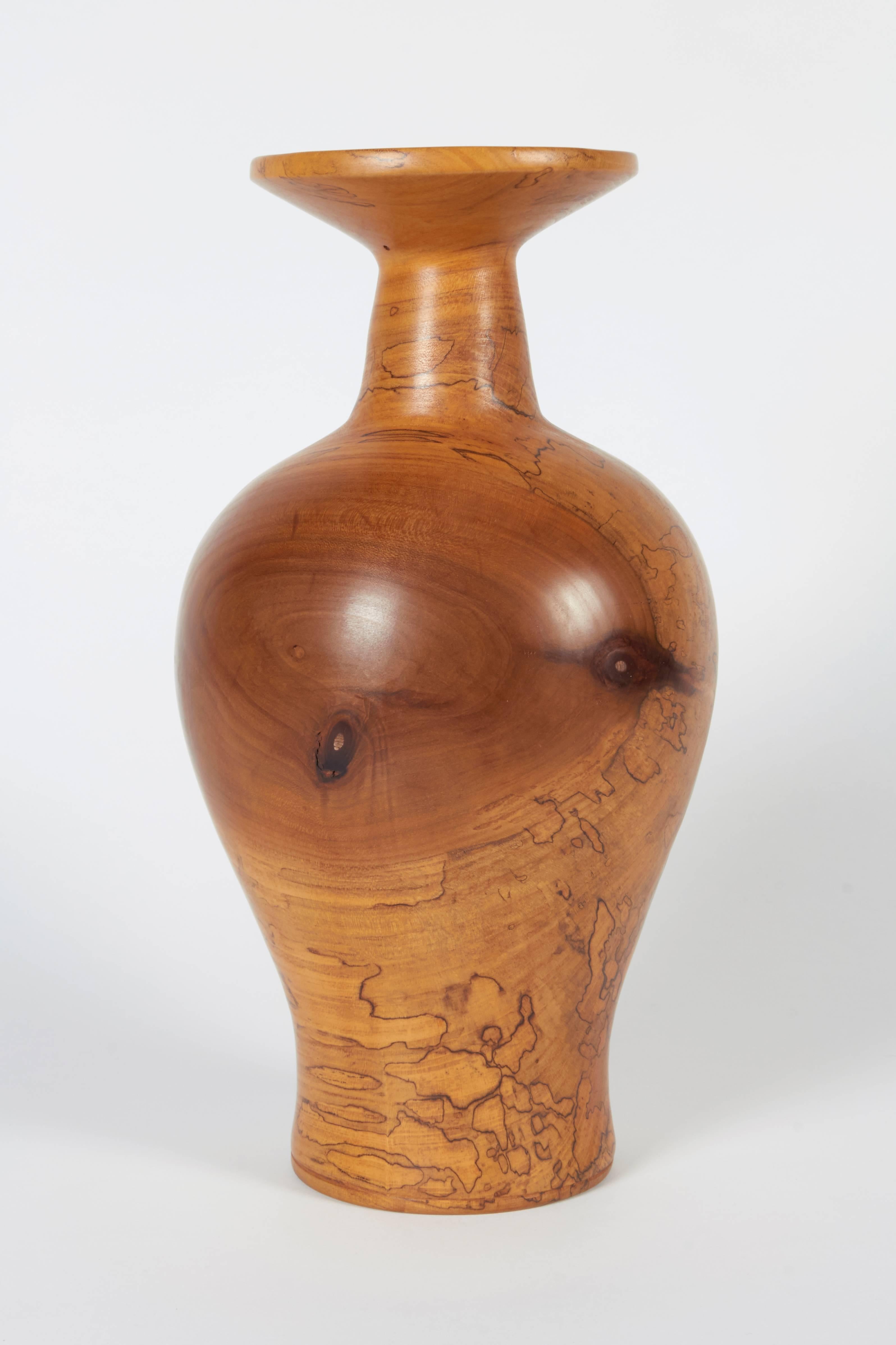 Melvin Lindquist began turning in the 1930s as a vertical turret lathe operator for the General Electric Company. In his shop at home, he began an exploration of the vase form through woodturning which has continued for over 50 years. He was one of