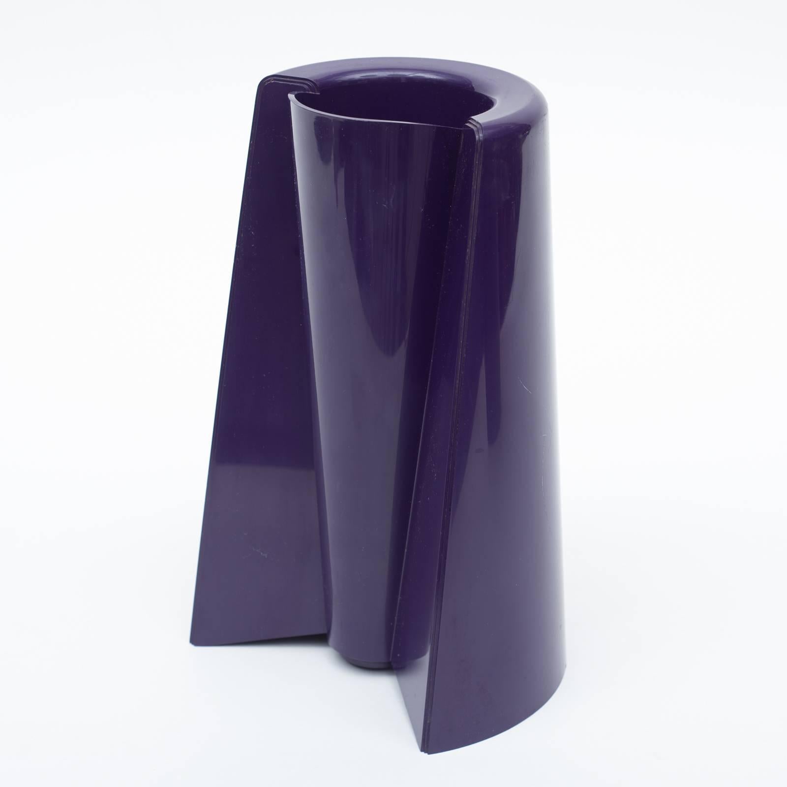 Designed by Enzo Mari in the 1960s this Pago Pago vase is dark purple plastic and can be used standing on either end. Marked on the inside bottom of the vase.  