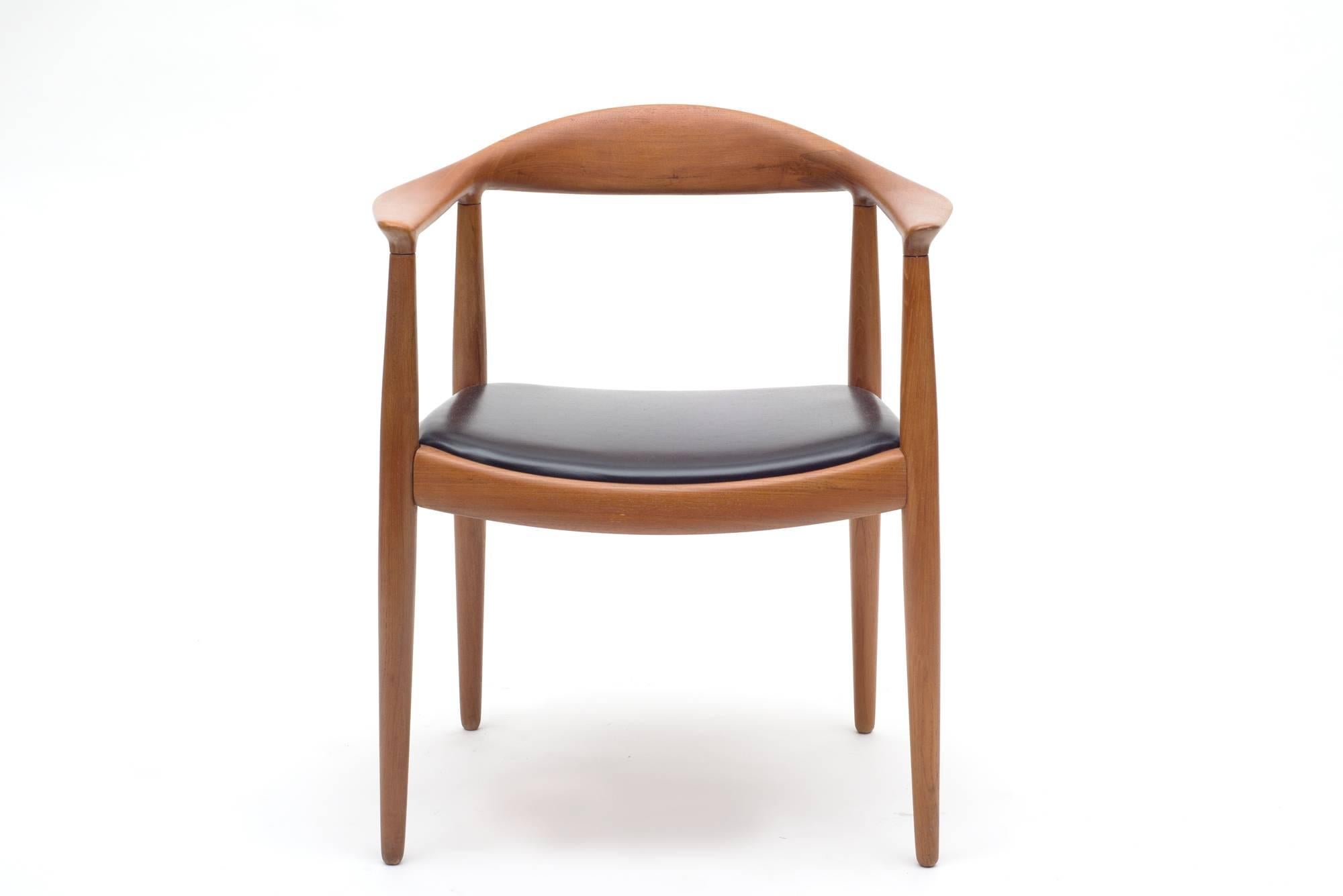 Hand-carved teak frames with distinctive joinery create a sophisticated simplicity found in the best Danish design. Branded with Johannes Hansen marks, in excellent refinished condition.