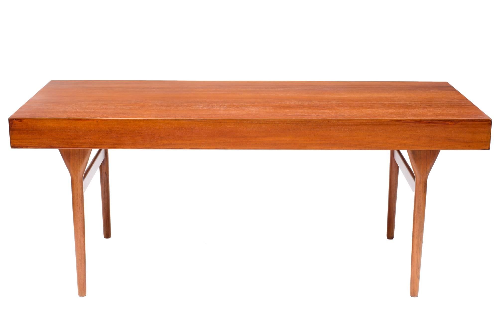 Perhaps the most beautiful Mid-Century desk ever designed. This desk by Danish great Nanna Ditzel and Jorgen Ditzel is amply proportioned (69