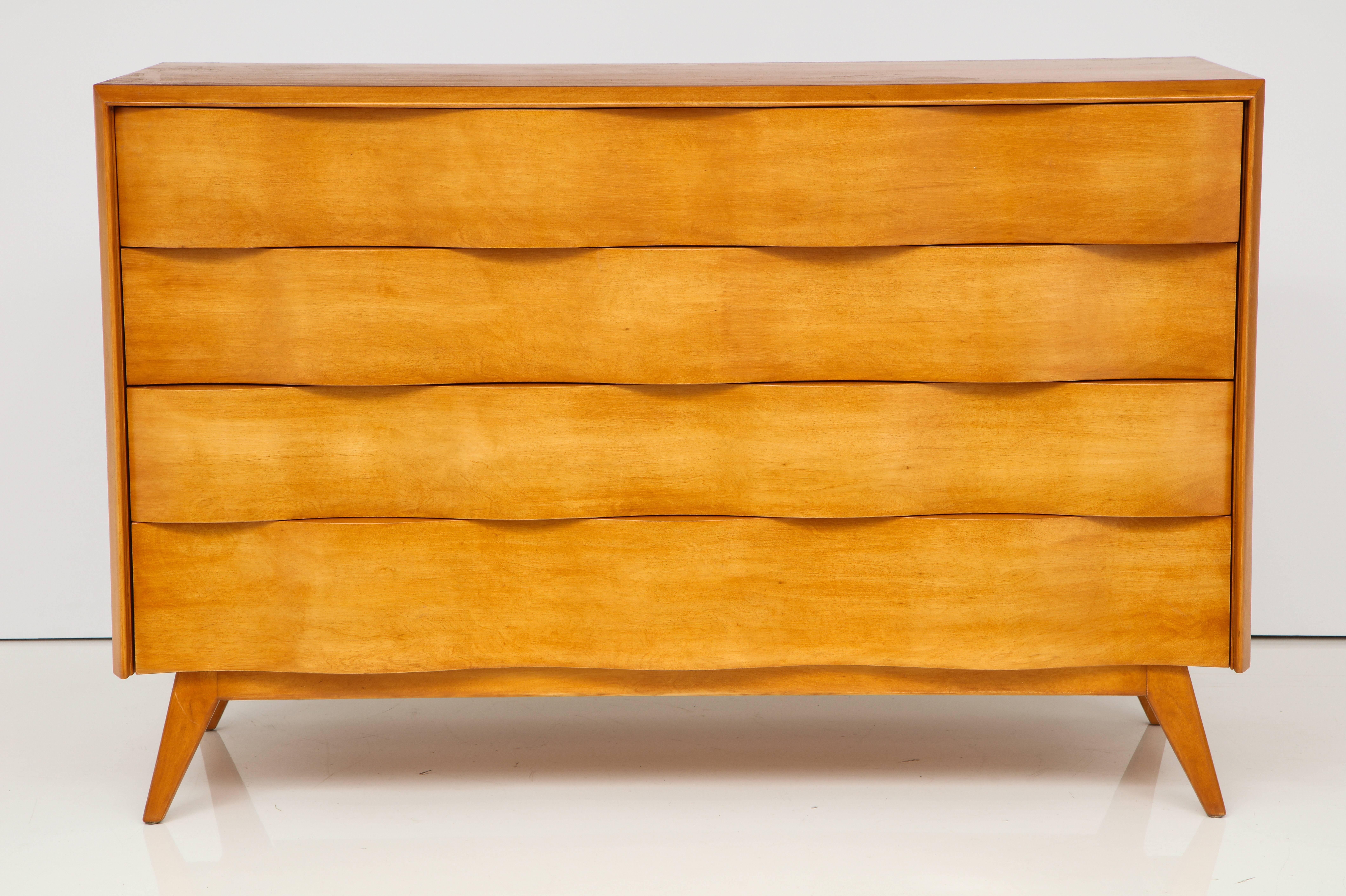 The furniture designed by Edmond Spence is always recognizable for it's distinctively different style. These chests have substantial storage capacity.