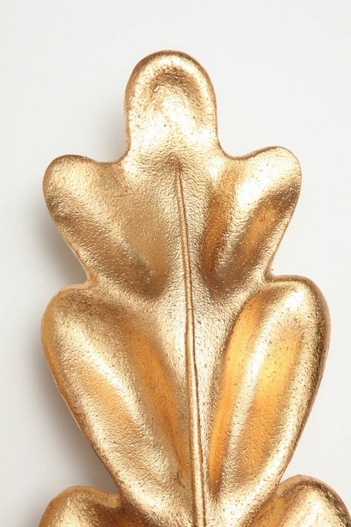 Decorative gold leaf sconces, circa 1950.