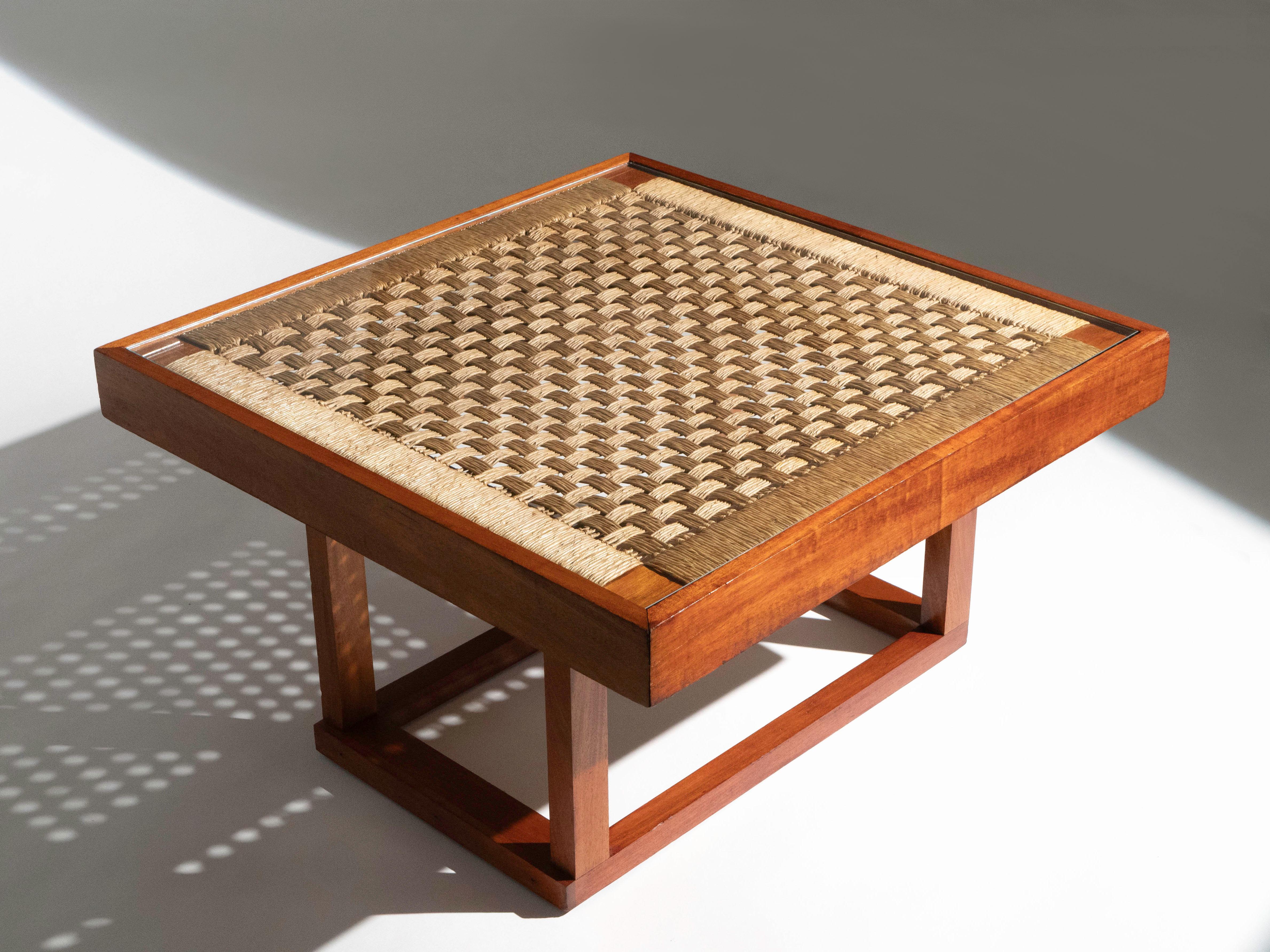 A woven table with glass top by designer Clara Porset for Meubles Austin. Made in Mexico, circa 1950's. The table is often referred to as her 