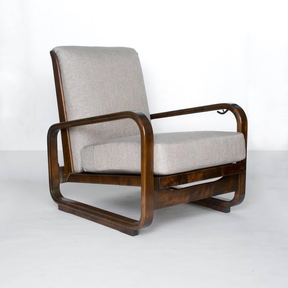 Pair of Swedish Art Deco modernist adjustable lounge chairs by Erik Chambert ( 1902 - 1988 ) in stained solid birch wood. The chair's seat cantilever in the back and may be adjusted by releasing a discreet mechanism under the left arm. The carved