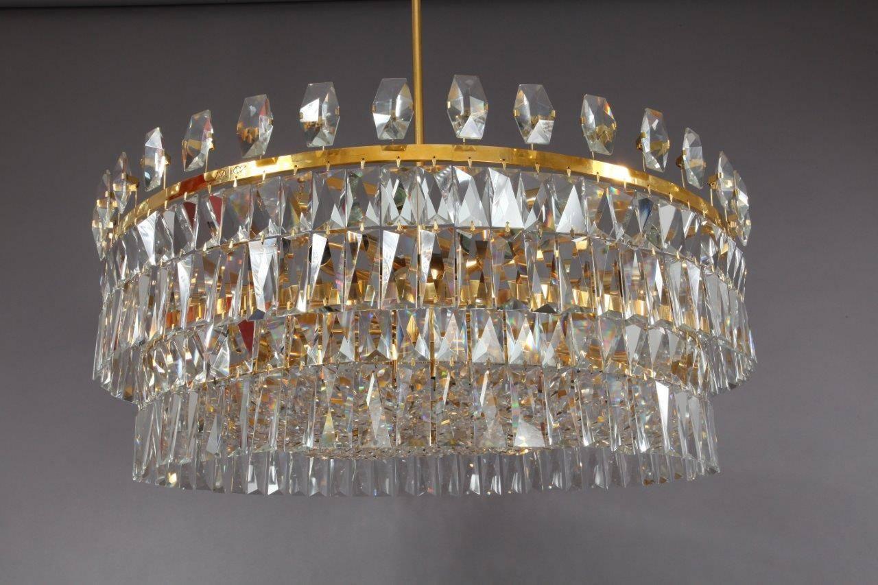Huge crystal chandelier with three tiers of crystals and gilded metal by Lobmeyr for the Markthalle in Feldkirch, Austria, circa 1972.
Newly electrified with 30 standard base sockets.