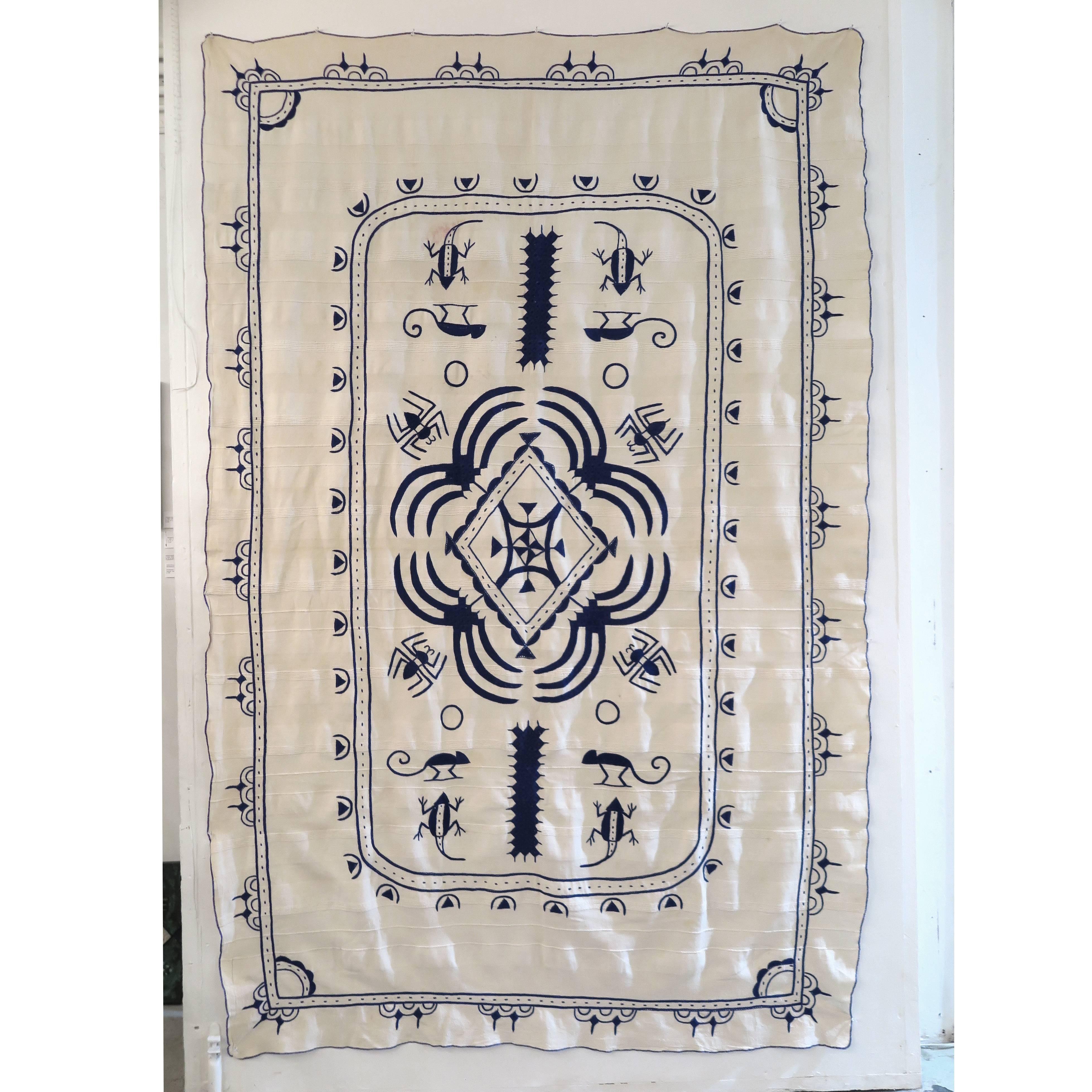Hand embroidered African wall hanging in off-white with natural dyed indigo embroideries, Cameroon.