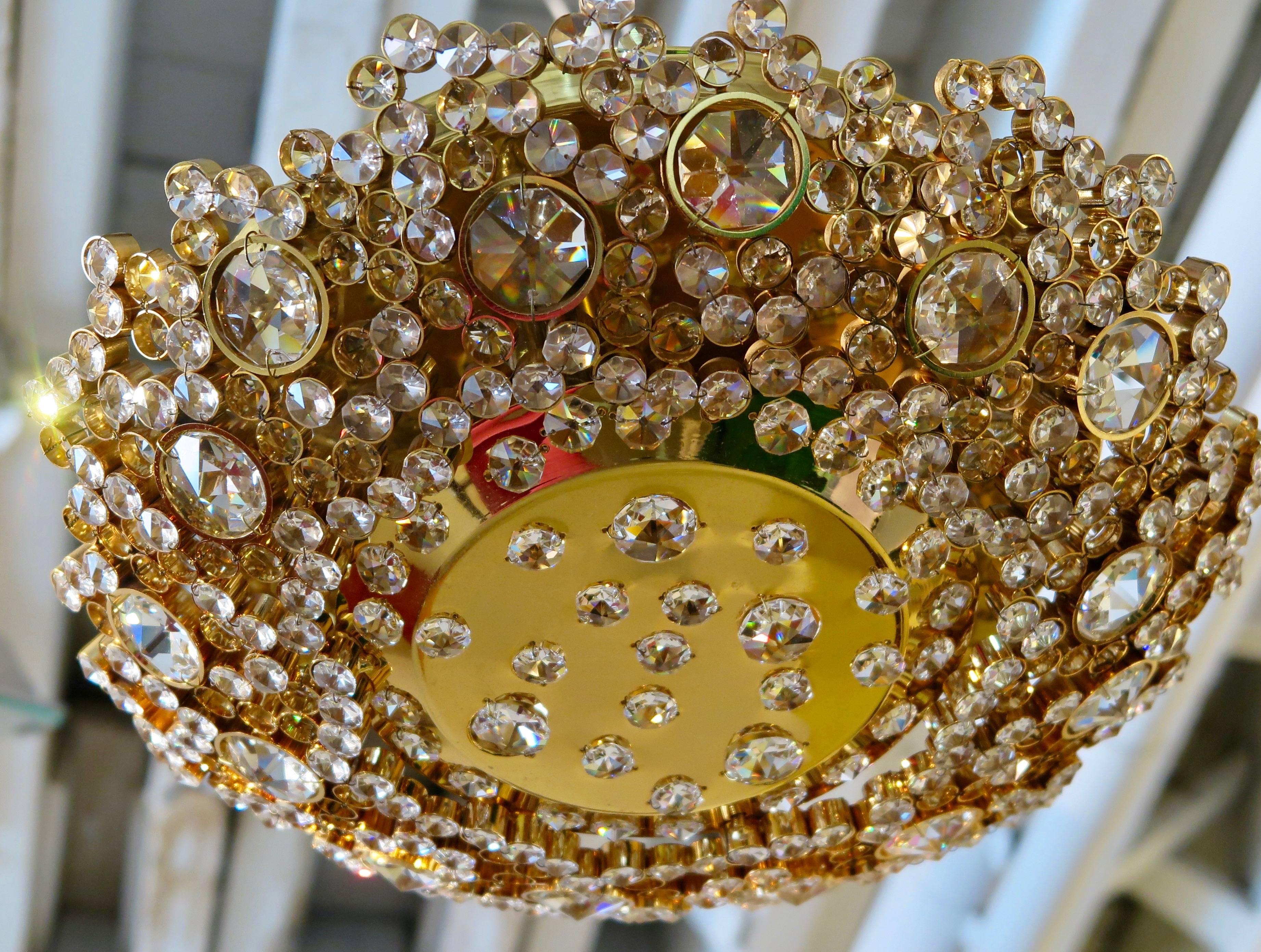 Gold-plated brass flush mount dome shaped light fixture with crystals in the style of Lobmeyr, Austria, circa 1960. Newly electrified with five candelabra sockets.