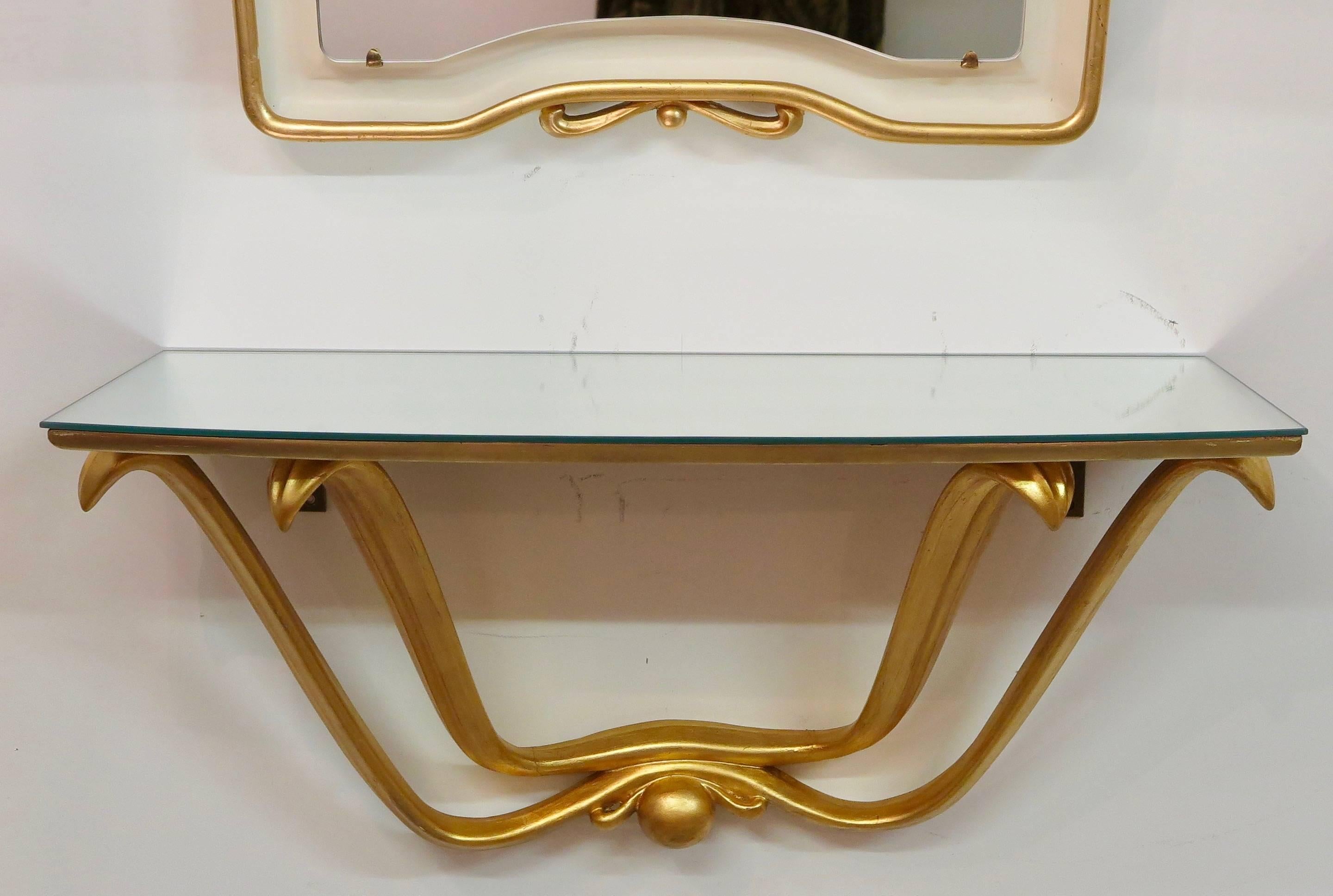 Gilded mirror and gilded console with mirrored top by Osvaldo Borsani, Italy, circa 1946.