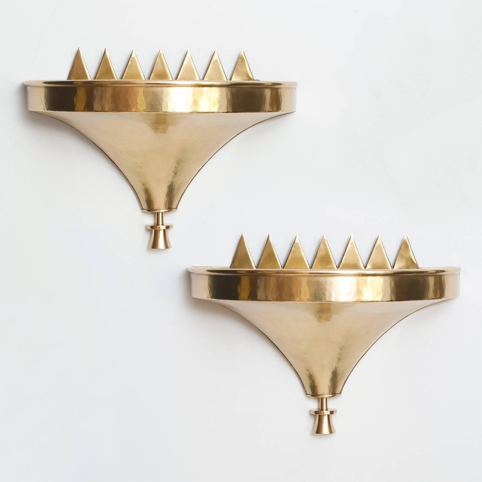 Pair of Art Deco demilune hammered and polished brass sconces with stylized flames designed by Lars Holmström for Arvika, Sweden, 1925. Impressed mark on back.
The sconces are newly polished and lacquered and rewired with three standard base