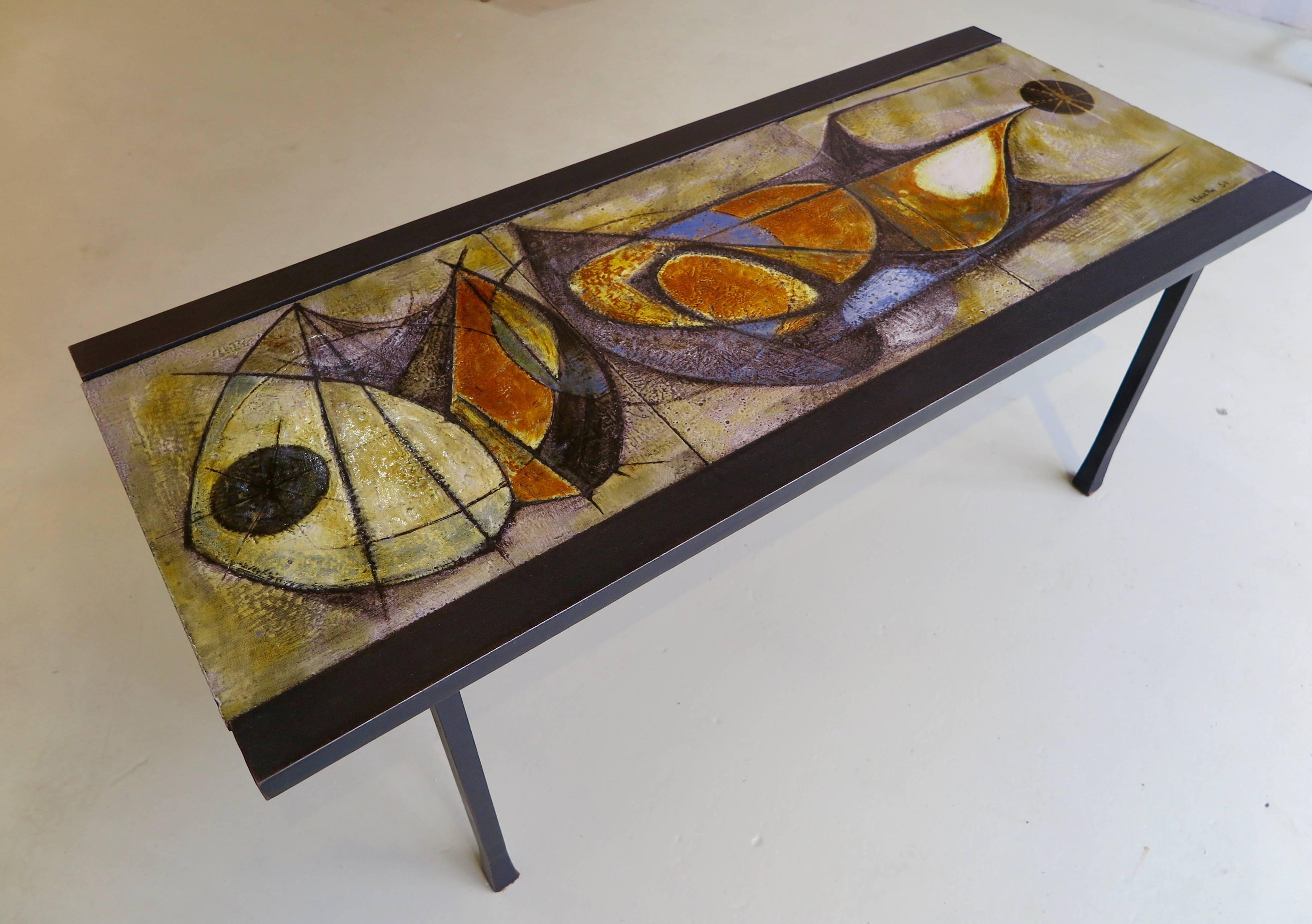 Unique ceramic coffee table with three distinctive painted ceramic tiles sitting on a rectangular iron frame by artist Pierre Saint-Paul, France, circa 1950.
Pierre Saint-Paul (1926) worked in South of France where he met Pablo Picasso, Salvador